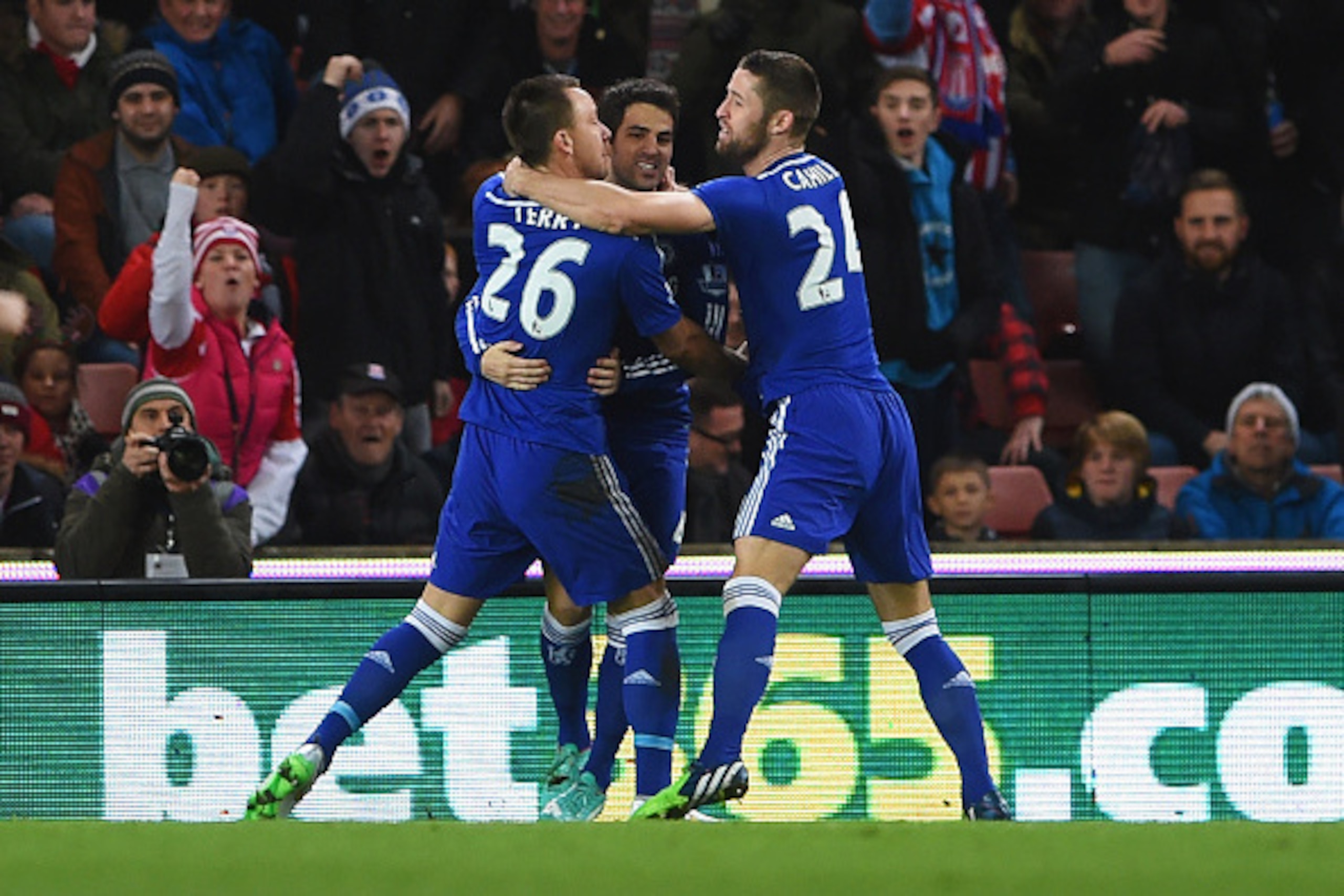 STOKE ON TRENT, ENGLAND - DECEMBER 22:  John Terry of Chelsea (26) celebrates with Cesc Fabregas (C) and Gary Cahill (R) as he scores their first goal during the Barclays Premier League match between Stoke City and Chelsea at Britannia Stadium on December