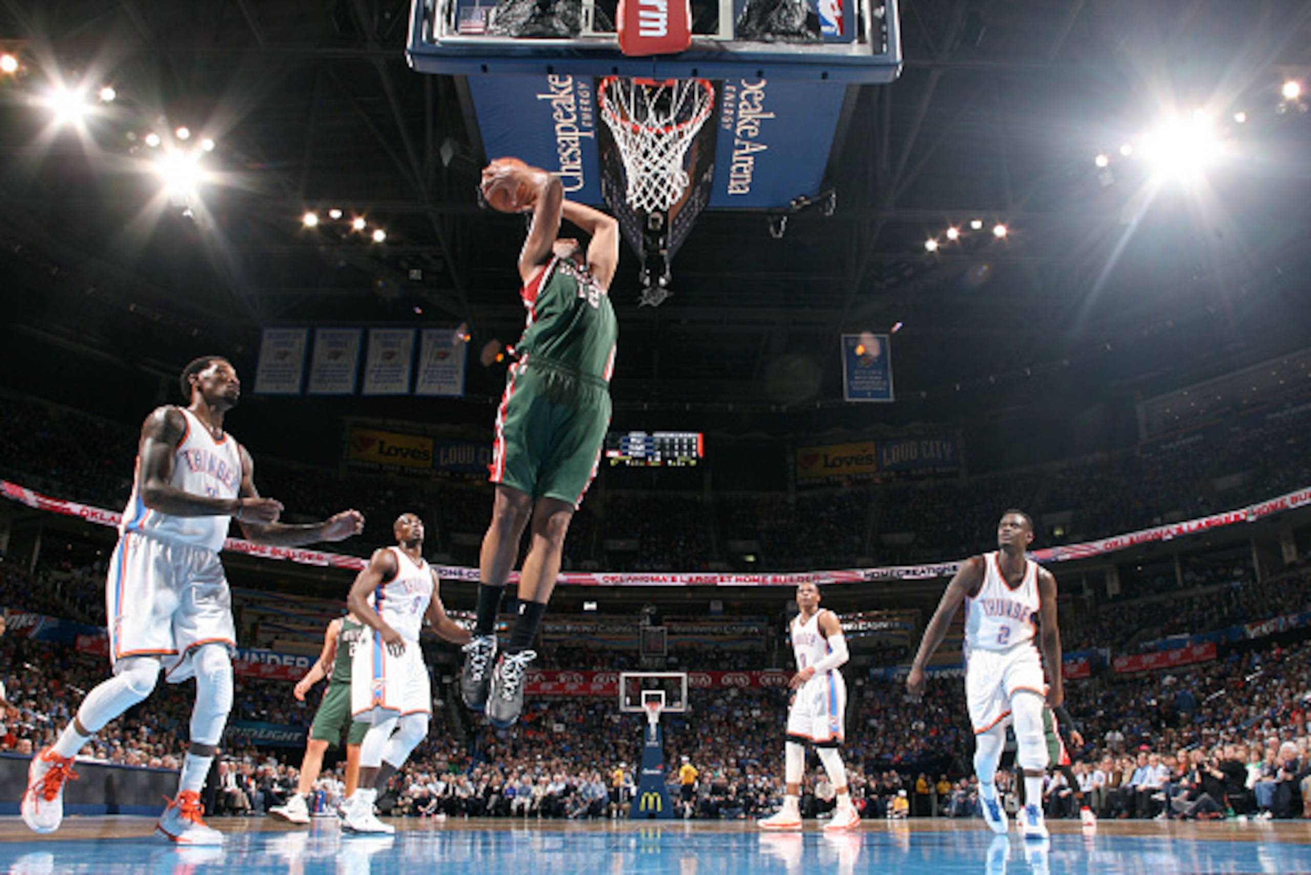 OKLAHOMA CITY, OK- DECEMBER 9: Jabari Parker #12 of the Milwaukee Bucks dunks against the Oklahoma City Thunder on December 9, 2014 at Chesapeake Energy Arena in Oklahoma City, OK. NOTE TO USER: User expressly acknowledges and agrees that, by downloading OKLAHOMA CITY, OK- DECEMBER 9: Jabari Parker #12 of the Milwaukee Bucks dunks against the Oklahoma City Thunder on December 9, 2014 at Chesapeake Energy Arena in Oklahoma City, OK. NOTE TO USER: User expressly acknowledges and agrees that, by downloading