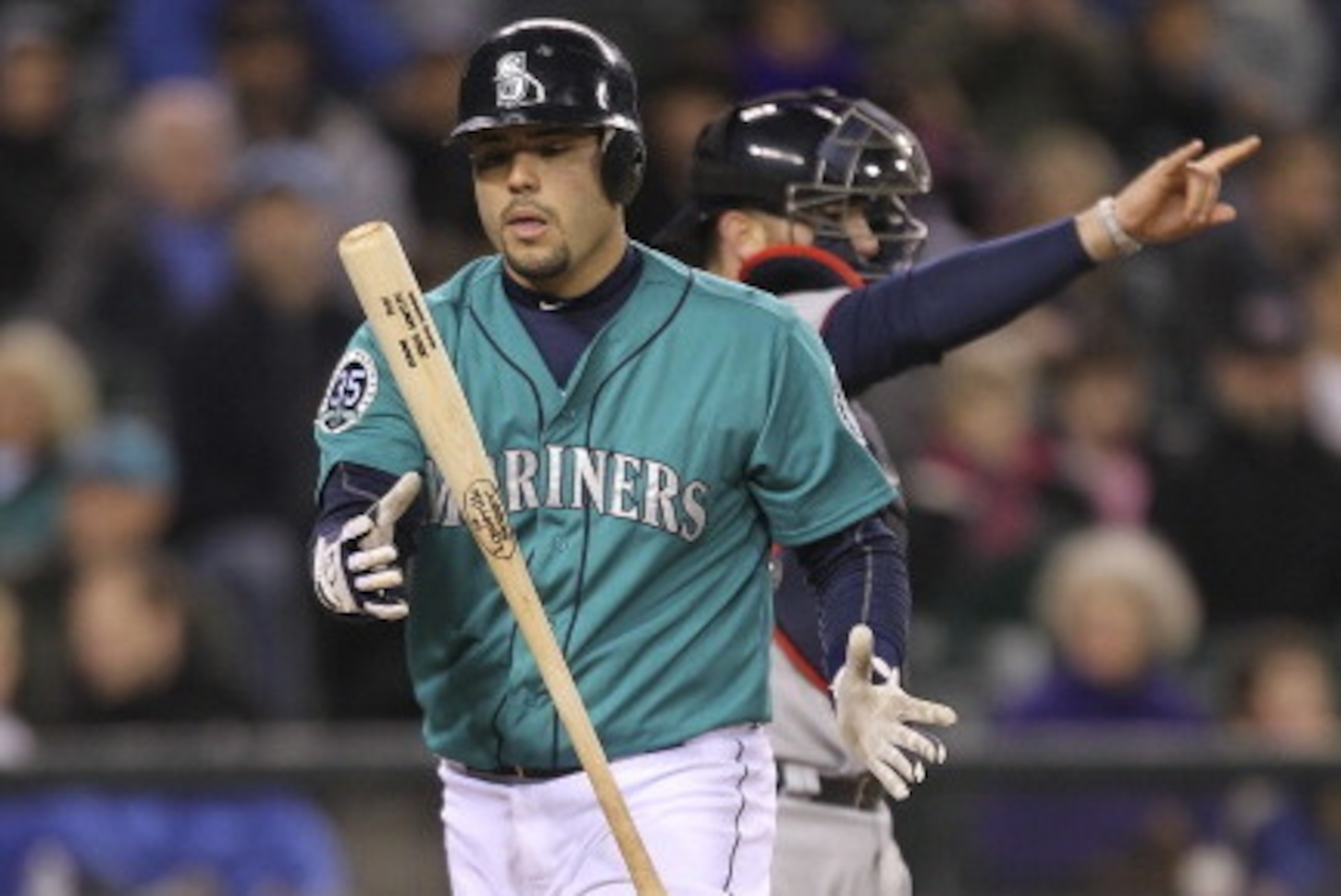 SEATTLE, WA - MAY 04:  Jesus Montero #63 of the Seattle Mariners heads back to the dugout after striking out in the ninth inning in a 3-2 loss to the Minnesota Twins at Safeco Field on May 4, 2012 in Seattle, Washington. (Photo by Otto Greule Jr/Getty Ima