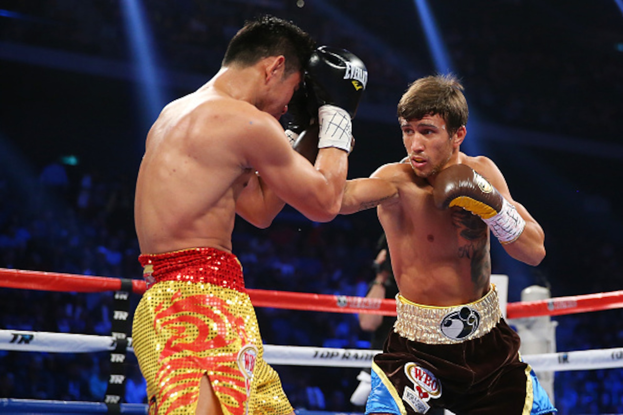 MACAU - NOVEMBER 23:  Vasyl Lomachenko of the Ukraine punches Chonlatarn Piriyapinyo of Thailand during the WBO Featherweight world title fight at The Venetian on November 23, 2014 in Macau, Macau.  (Photo by Chris Hyde/Getty Images)