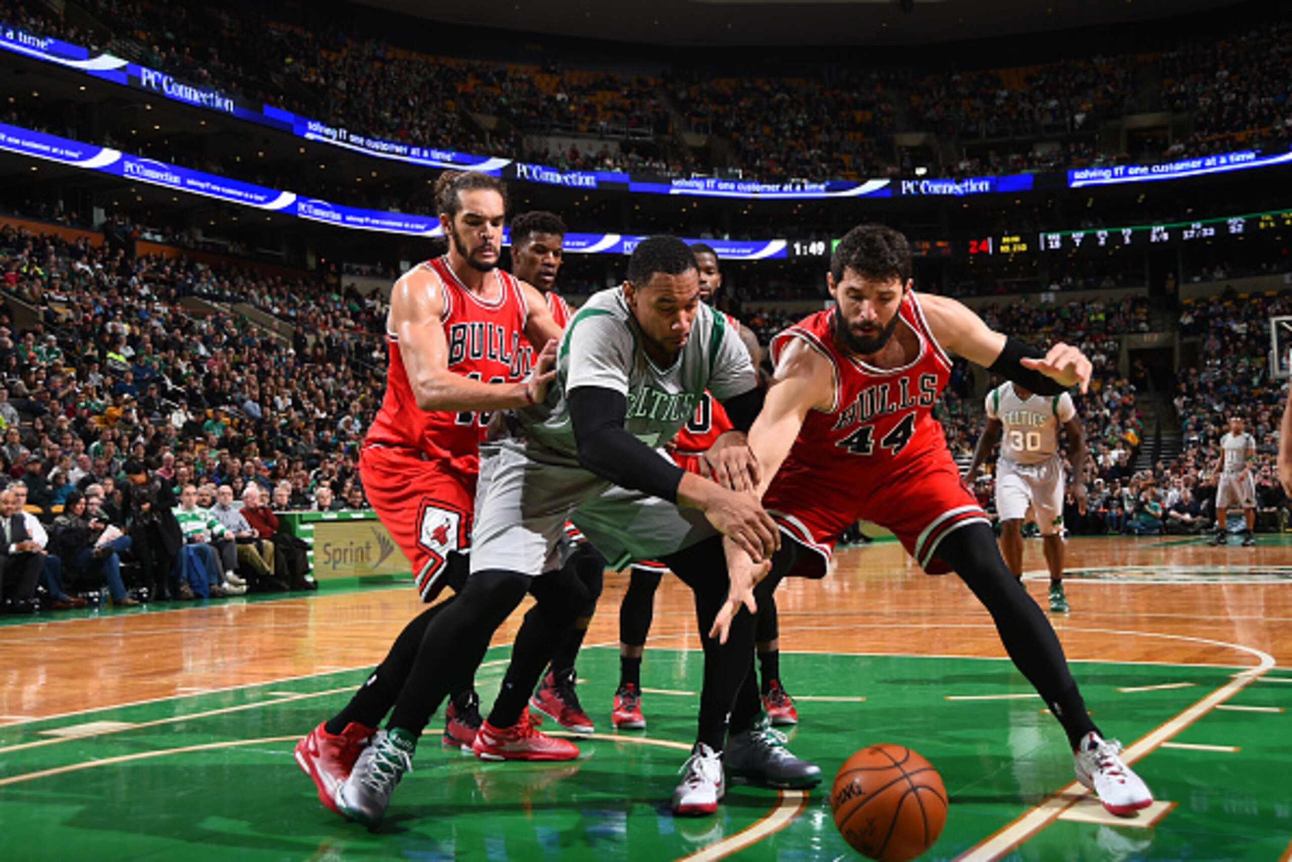 BOSTON, MA - NOVEMBER 28:  Nikola Mirotic #44 of the Chicago Bulls battles for the loose ball against Jared Sullinger #7 of the Boston Celtics on November 28, 2014 at the TD Garden in Boston, Massachusetts. NOTE TO USER: User expressly acknowledges and ag