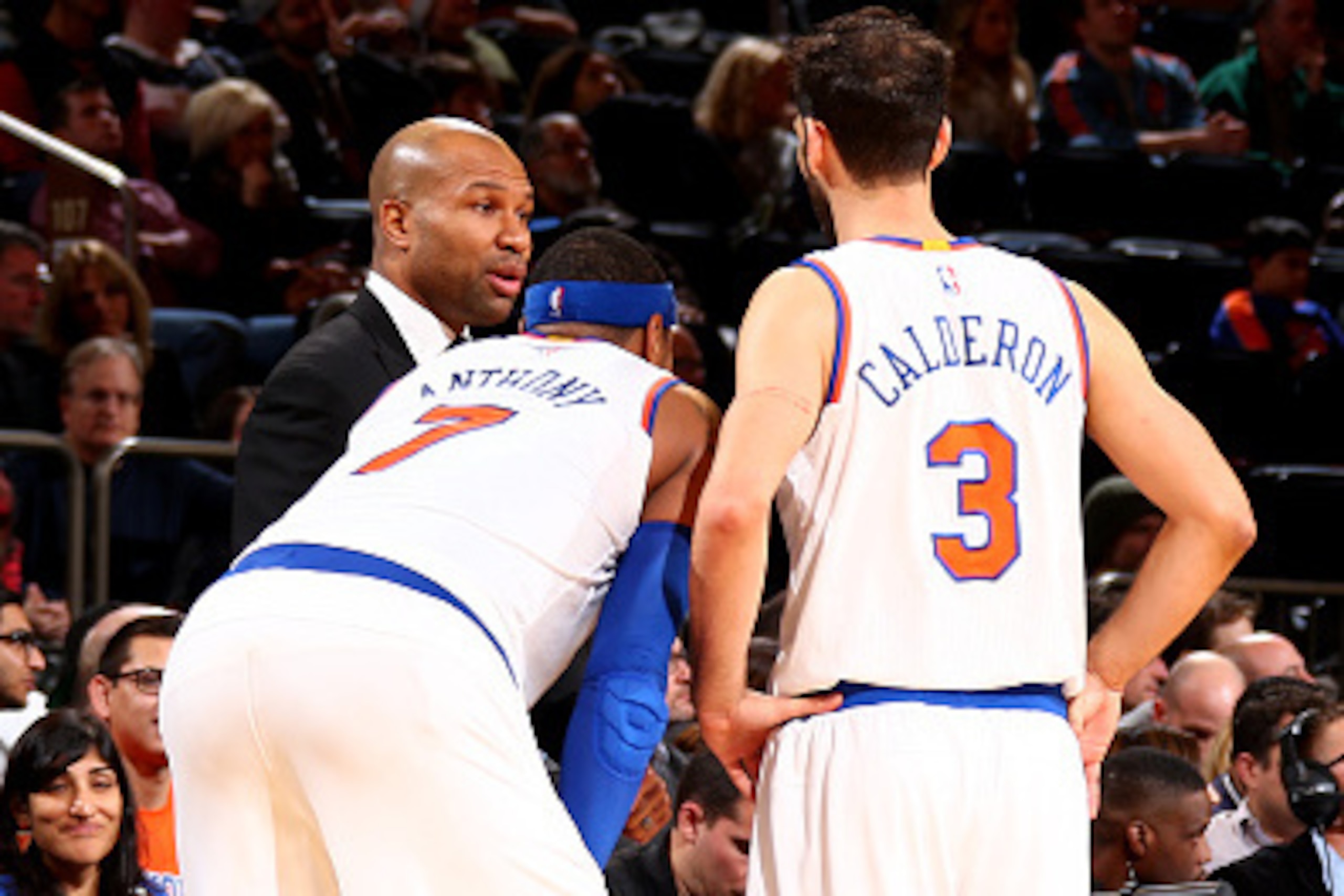 NEW YORK, NY - DECEMBER 14: Head Coach Derek Fisher, Carmelo Anthony #7, and Jose Calderon #3 of the New York Knicks talk strategy during a game between the Toronto Raptors at Madison Square Garden on December 14, 2014 in New York City, New York. NOTE TO NEW YORK, NY - DECEMBER 14: Head Coach Derek Fisher, Carmelo Anthony #7, and Jose Calderon #3 of the New York Knicks talk strategy during a game between the Toronto Raptors at Madison Square Garden on December 14, 2014 in New York City, New York. NOTE TO