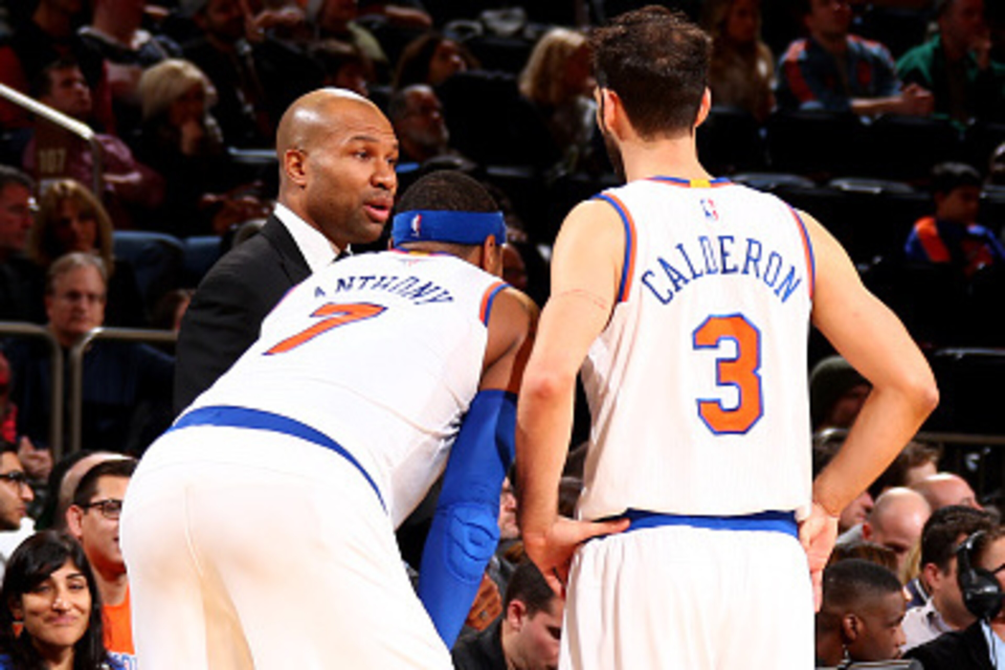 NEW YORK, NY - DECEMBER 14: Head Coach Derek Fisher, Carmelo Anthony #7, and Jose Calderon #3 of the New York Knicks talk strategy during a game between the Toronto Raptors at Madison Square Garden on December 14, 2014 in New York City, New York. NOTE TO NEW YORK, NY - DECEMBER 14: Head Coach Derek Fisher, Carmelo Anthony #7, and Jose Calderon #3 of the New York Knicks talk strategy during a game between the Toronto Raptors at Madison Square Garden on December 14, 2014 in New York City, New York. NOTE TO