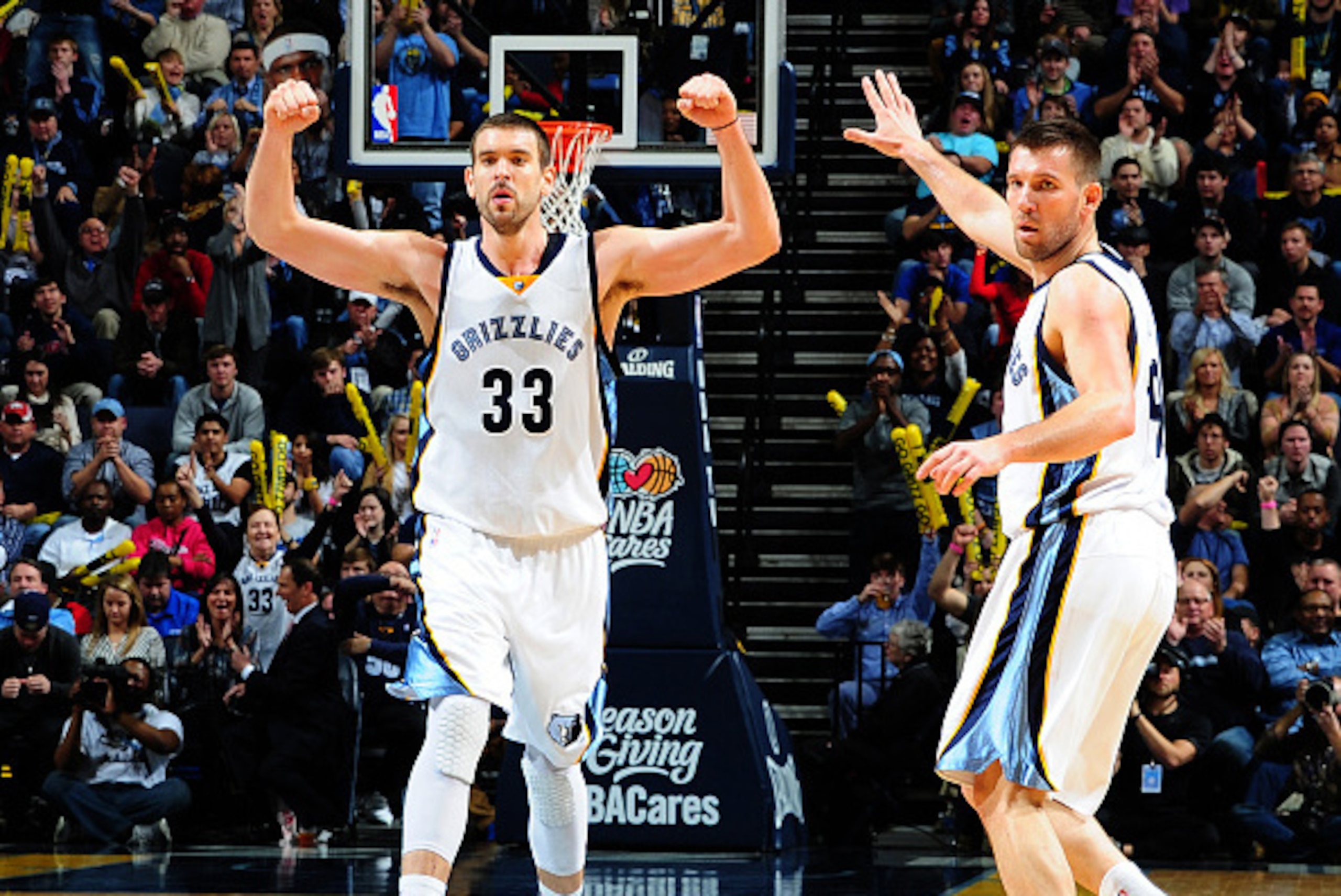 MEMPHIS, TN - DECEMBER 16: Marc Gasol #33 and Beno Udrih #19 of the Memphis Grizzlies celebrate after a score against the Golden State Warriors on December 16, 2014 at the FedEx Forum in Memphis, Tennessee.  NOTE TO USER: User expressly acknowledges and a