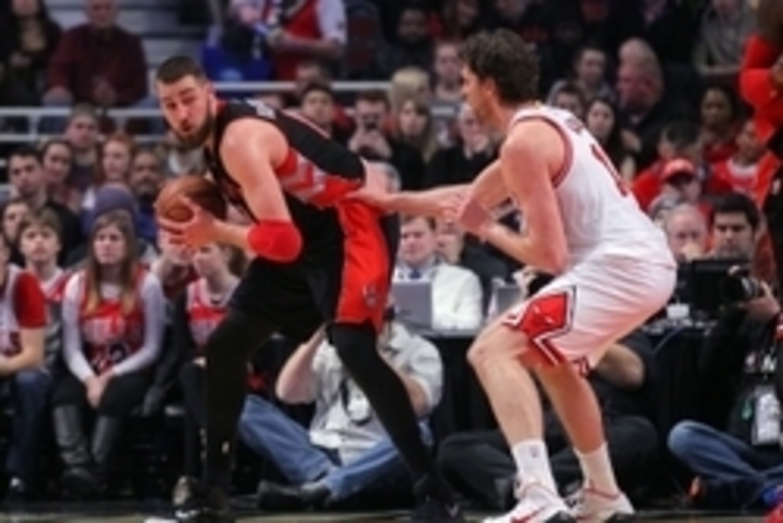 Dec 22, 2014; Chicago, IL, USA; Toronto Raptors center Jonas Valanciunas (17) is defended by Chicago Bulls forward Pau Gasol (16) during the first quarter of a game at the United Center. Mandatory Credit: Dennis Wierzbicki-USA TODAY Sports