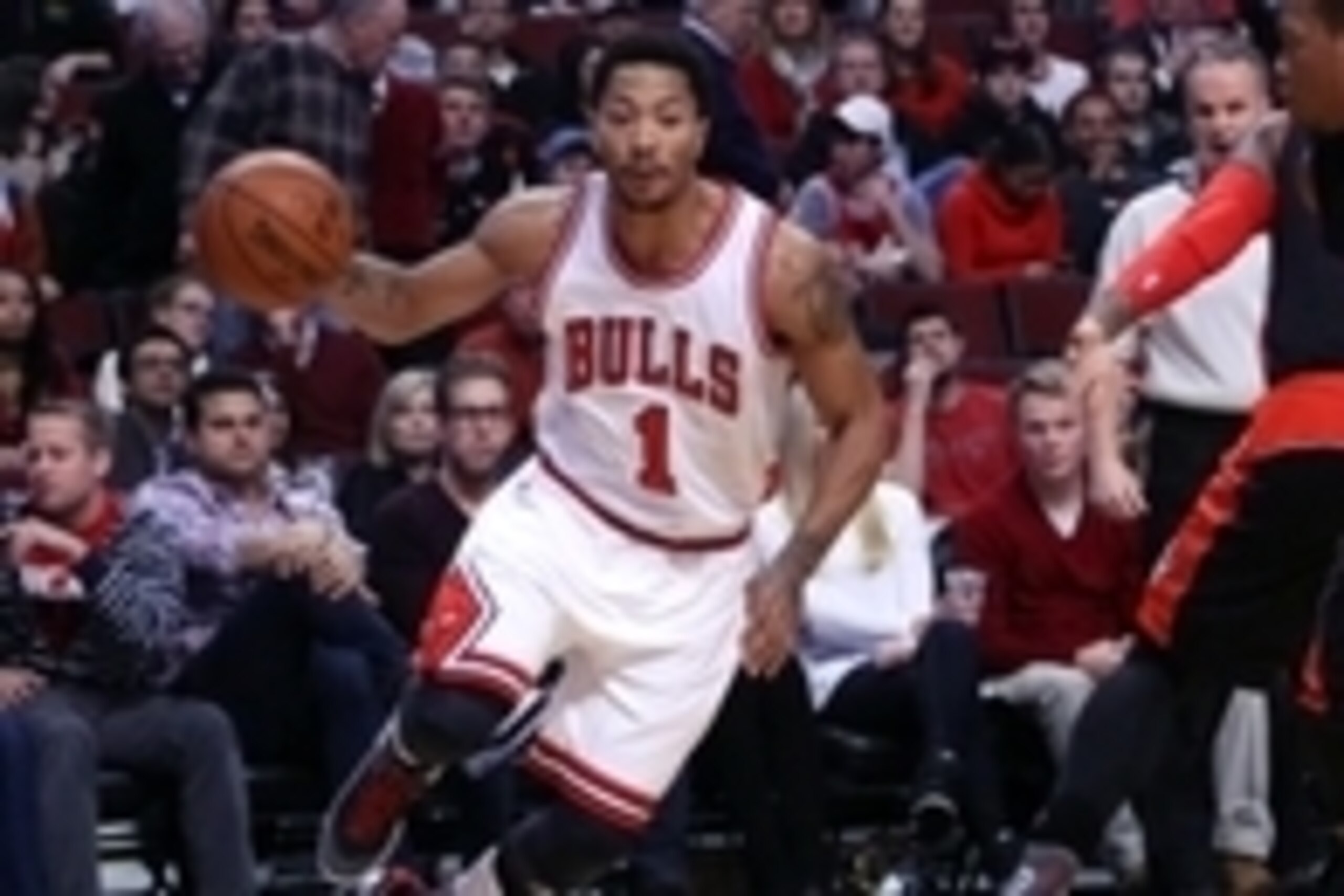 Dec 22, 2014; Chicago, IL, USA; Chicago Bulls guard Derrick Rose (1) drives past Toronto Raptors guard Kyle Lowry (7) during the first quarter of a game at the United Center. Mandatory Credit: Dennis Wierzbicki-USA TODAY Sports