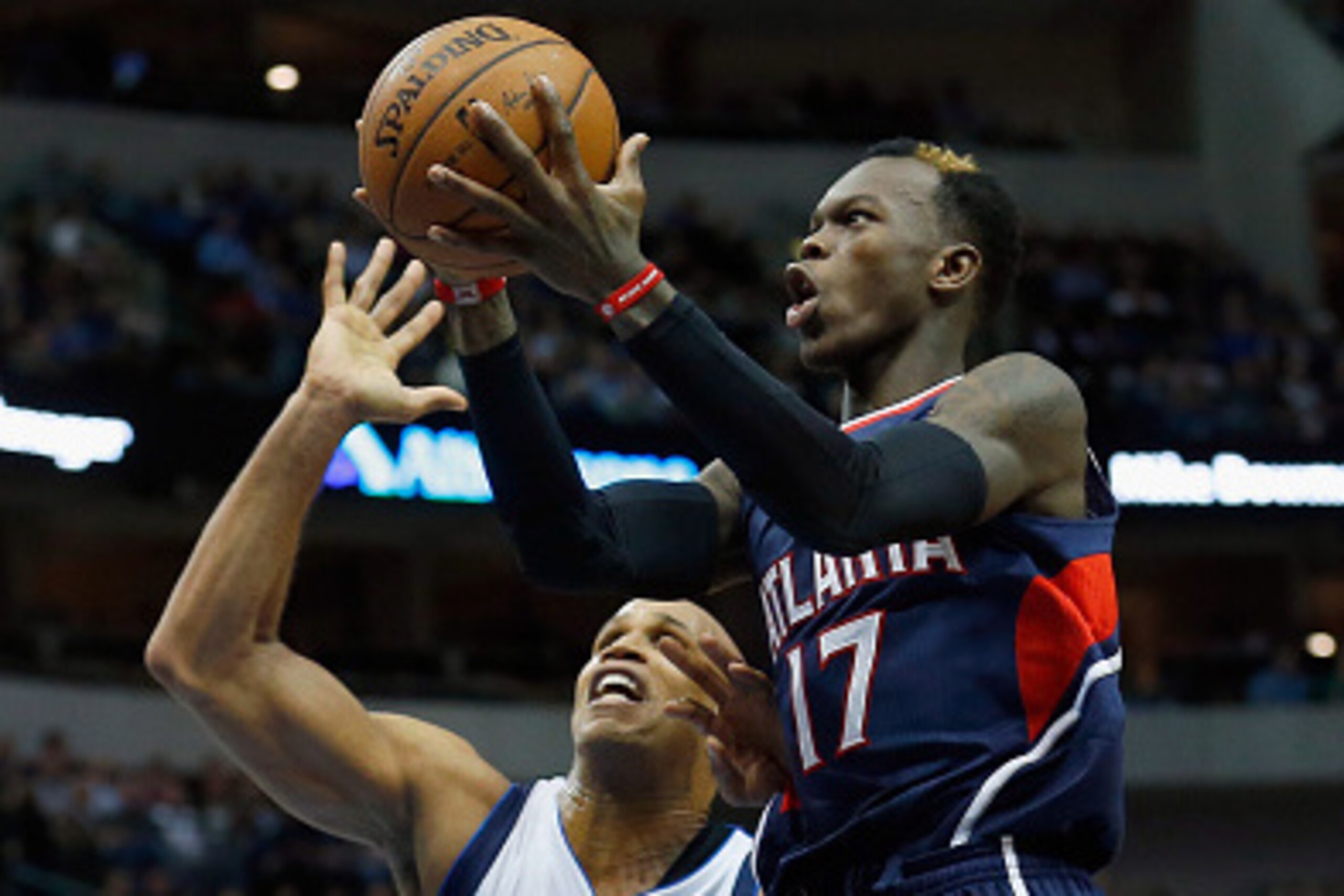 DALLAS, TX - DECEMBER 22:  Dennis Schroder #17 of the Atlanta Hawks drives to the basket against Richard Jefferson #24 of the Dallas Mavericks in the first half at American Airlines Center on December 22, 2014 in Dallas, Texas. NOTE TO USER: User expressl