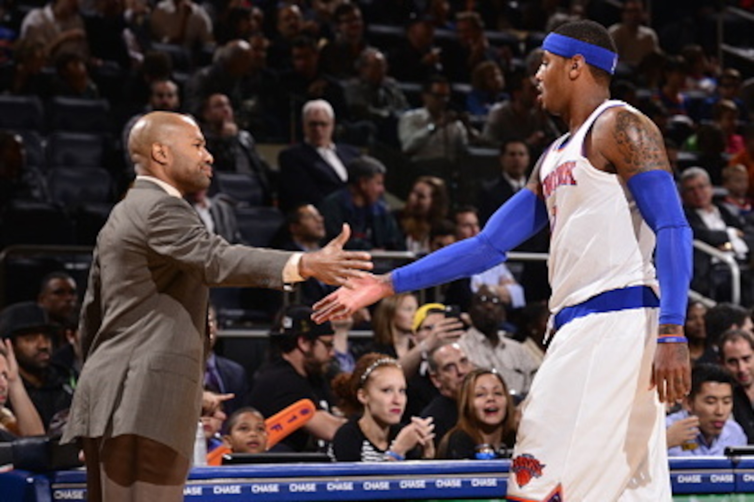 NEW YORK, NY - OCTOBER 13:  Head coach Derek Fisher of the New York Knicks shakes hands with Carmelo Anthony #7 during a game against the Toronto Raptors at Madison Square Garden on October 13, 2014 in New York City, New York. NOTE TO USER: User expressly