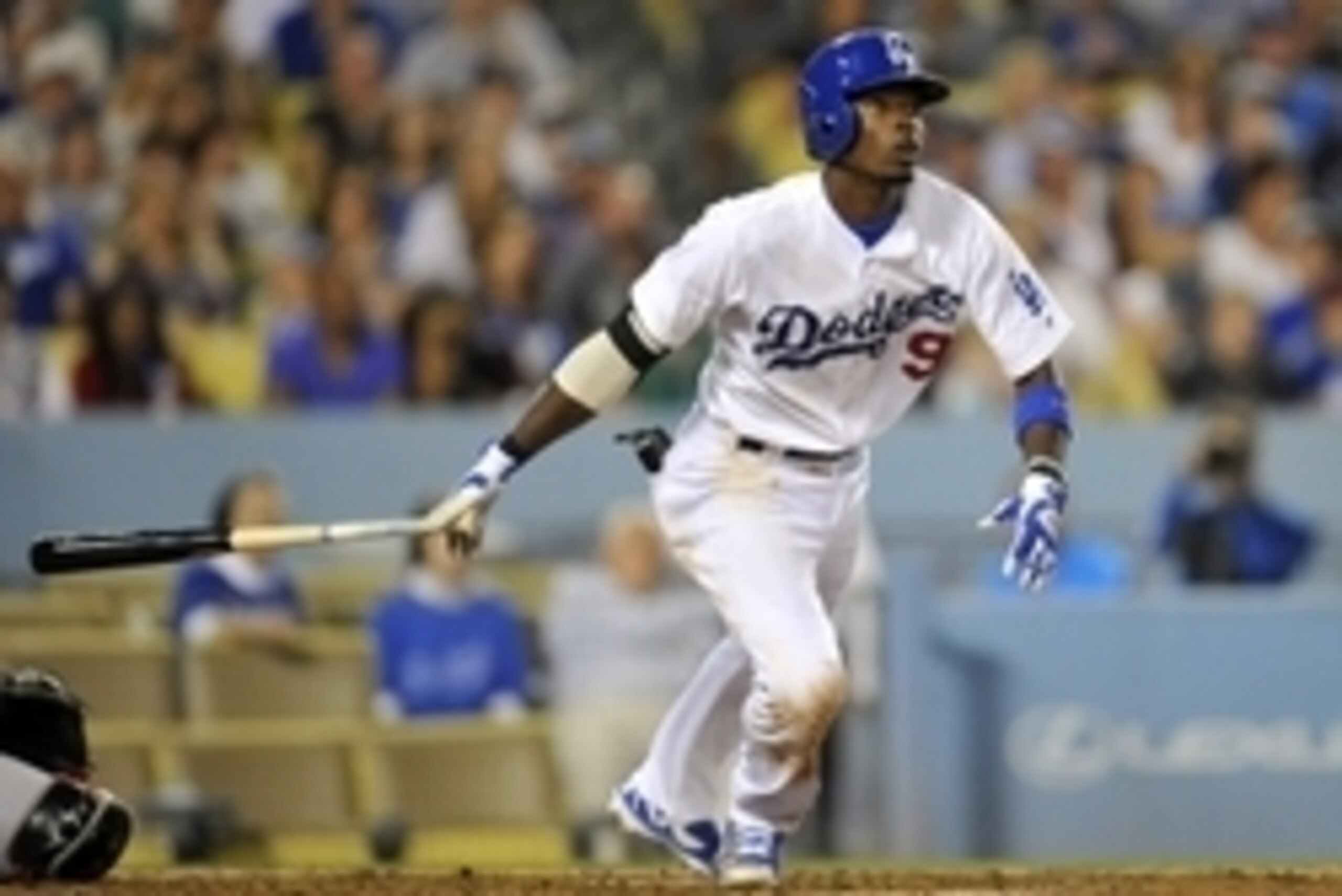 September 6, 2014; Los Angeles, CA, USA; Los Angeles Dodgers second baseman Dee Gordon (9) hits an RBI single in the eighth inning against the Arizona Diamondbacks at Dodger Stadium. Mandatory Credit: Gary A. Vasquez-USA TODAY Sports