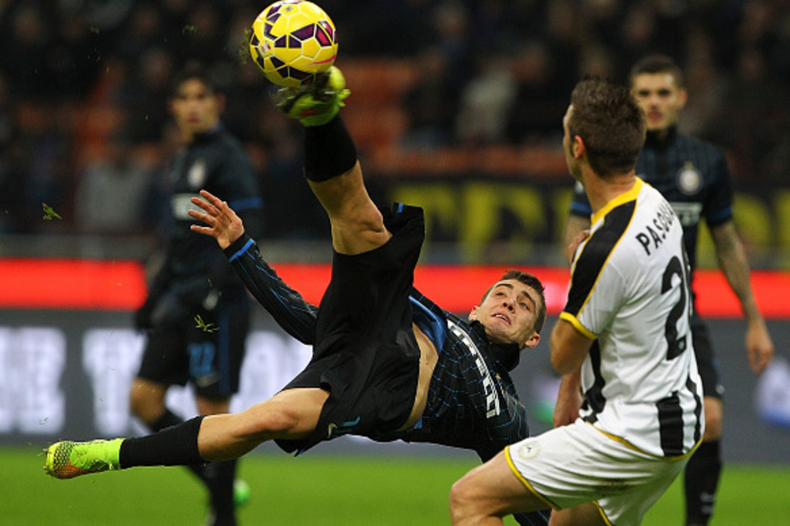 MILAN, ITALY - DECEMBER 07: Mateo Kovacic of FC Internazionale Milano attempts an overhead kick watched by Giovanni Pasquale of Udinese Calcio during the Serie A match between FC Internazionale Milano and Udinese Calcio at Stadio Giuseppe Meazza on Decem MILAN, ITALY - DECEMBER 07: Mateo Kovacic of FC Internazionale Milano attempts an overhead kick watched by Giovanni Pasquale of Udinese Calcio during the Serie A match between FC Internazionale Milano and Udinese Calcio at Stadio Giuseppe Meazza on Decem