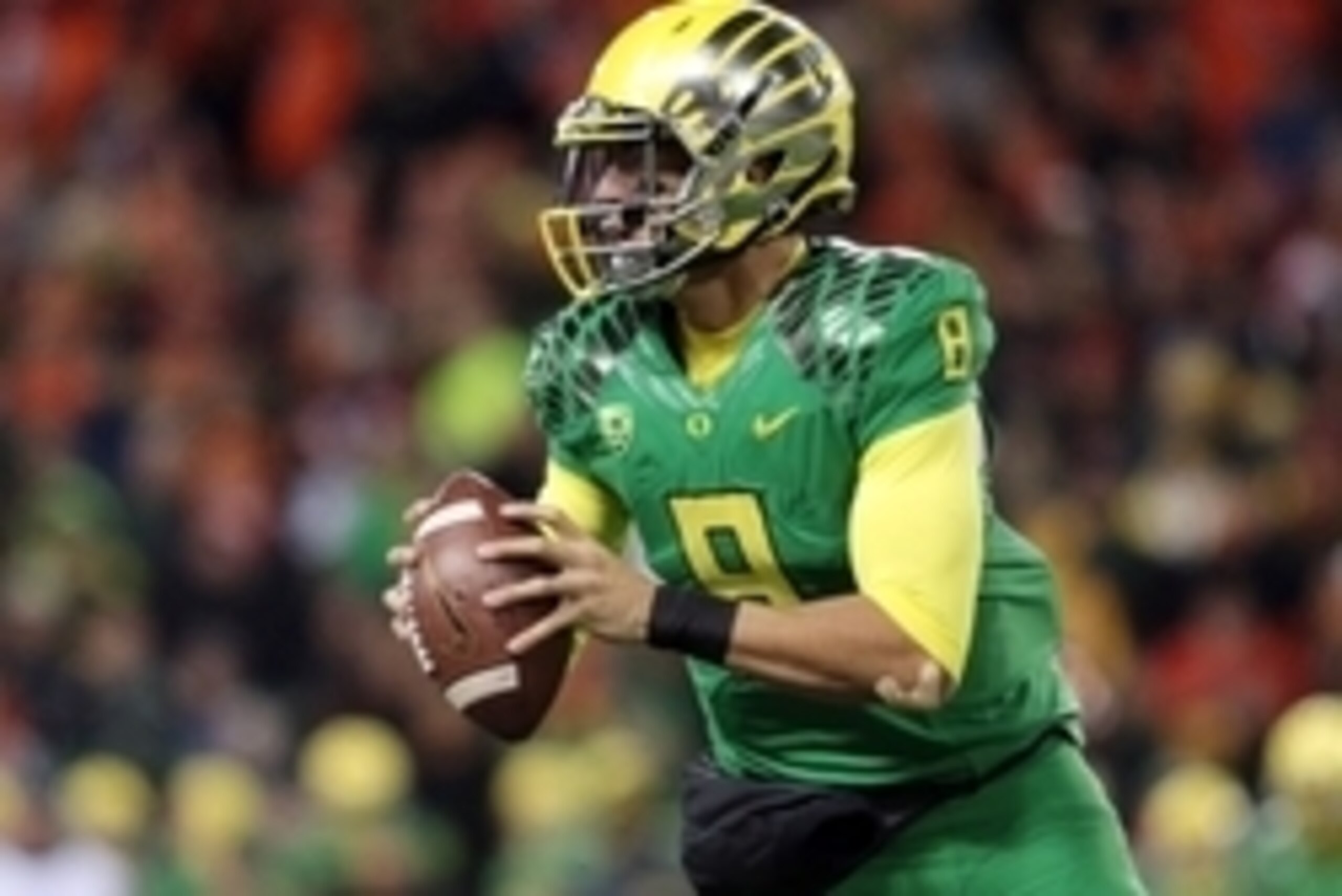 Nov 29, 2014; Corvallis, OR, USA; Oregon Ducks quarterback Marcus Mariota (8) runs the ball against the Oregon State Beavers at Reser Stadium. Mandatory Credit: Scott Olmos-USA TODAY Sports