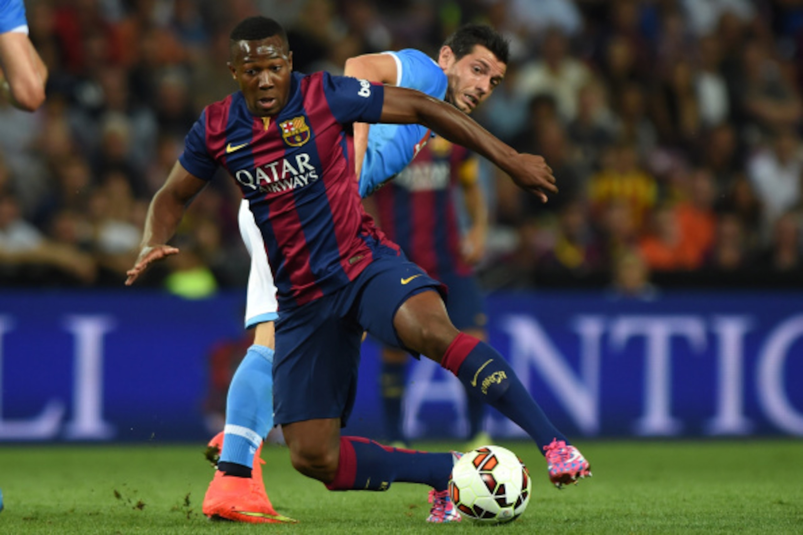 GENEVA, SWITZERLAND - AUGUST 06:  Adama Traore (L) of FC Barcelona is challenged by Blerim Dzemaili of SSC Napoli during the pre-season friendly match between FC Barcelona and SSC Napoli on August 6, 2014 in Geneva, Switzerland.  (Photo by Valerio Pennici