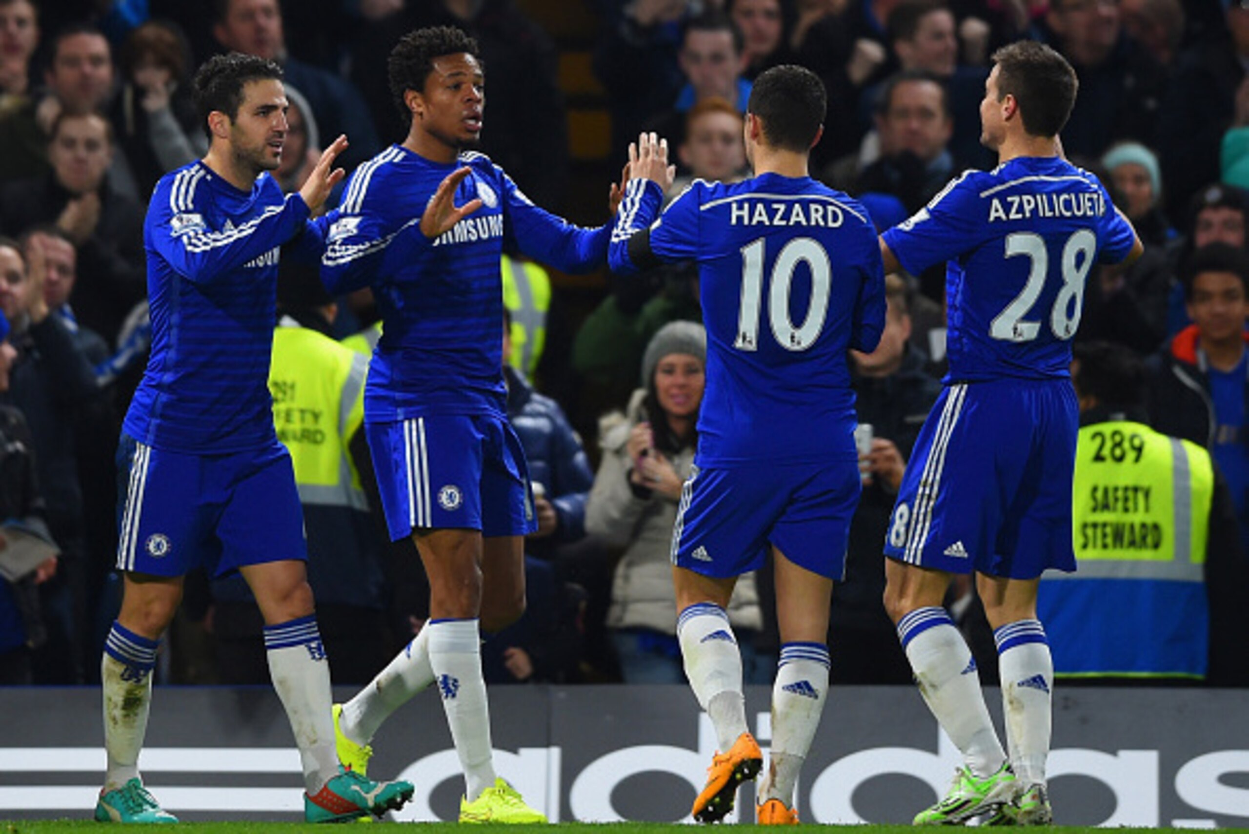 LONDON, ENGLAND - DECEMBER 03: Loic Remy of Chelsea (2L) celebrates scoring their third goal with Cesc Fabregas, Eden Hazard and Cesar Azpilicueta of Chelsea  during the Barclays Premier League match between Chelsea and Tottenham Hotspur at Stamford Bridg