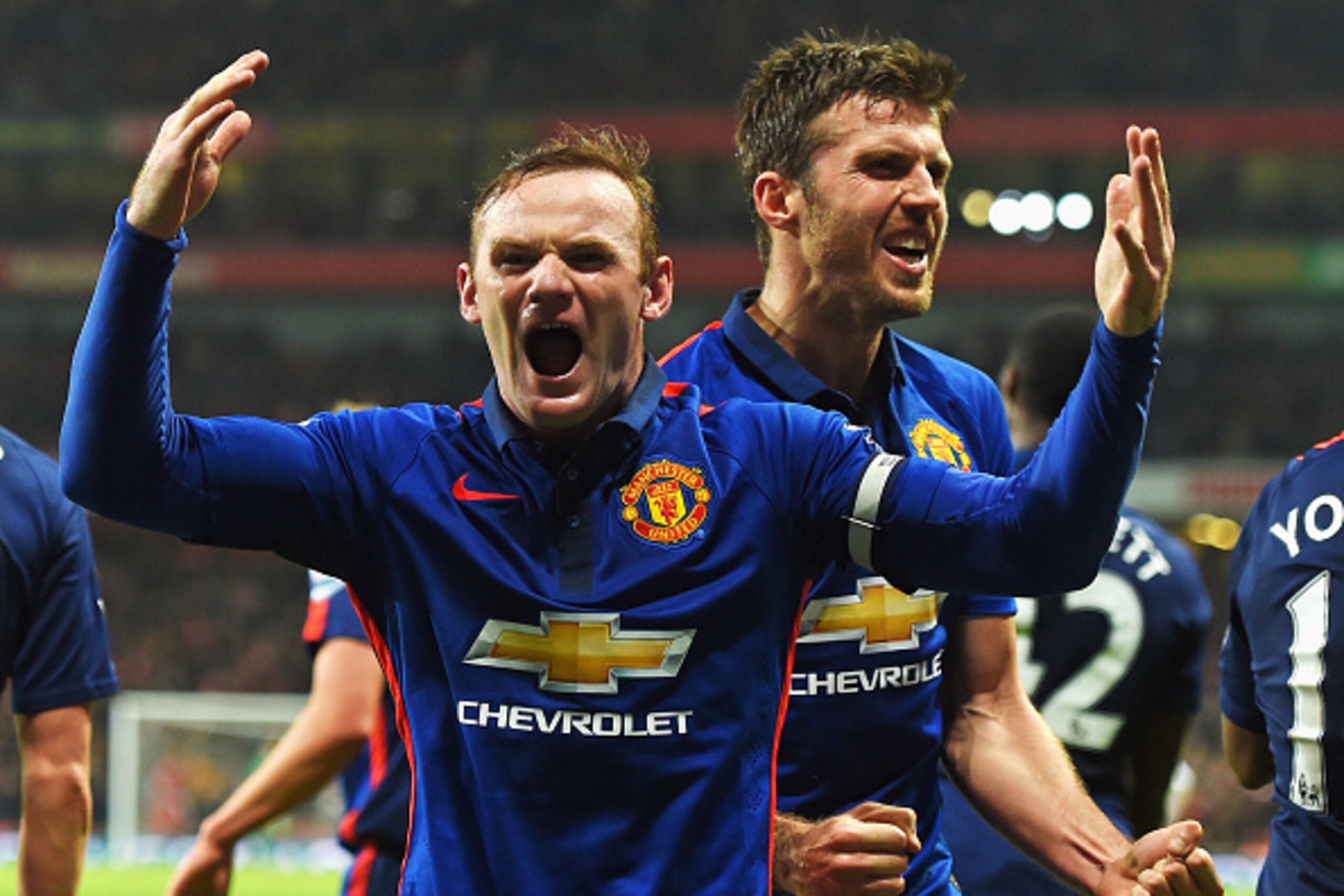 LONDON, ENGLAND - NOVEMBER 22: Wayne Rooney of Manchester United celebrates scoring his team's second goal with Michael Carrick of Manchester United during the Barclays Premier League match between Arsenal and Manchester United at Emirates Stadium on Nov LONDON, ENGLAND - NOVEMBER 22: Wayne Rooney of Manchester United celebrates scoring his team's second goal with Michael Carrick of Manchester United during the Barclays Premier League match between Arsenal and Manchester United at Emirates Stadium on Nov