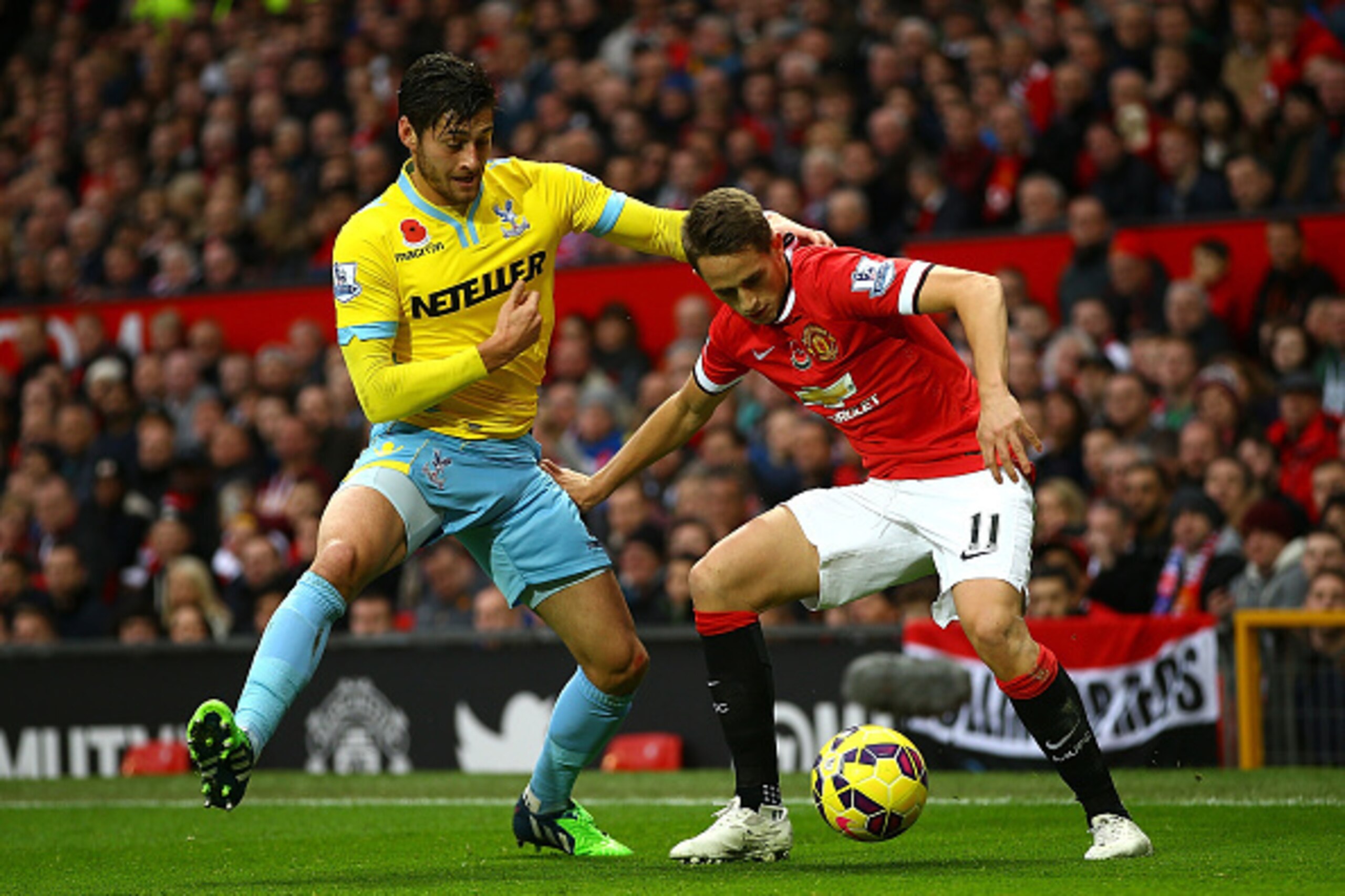 MANCHESTER, ENGLAND - NOVEMBER 08:  Adnan Januzaj of Manchester United competes with Joel Ward of Crystal Palace during the Barclays Premier League match between Manchester United and Crystal Palace at Old Trafford on November 8, 2014 in Manchester, Engla