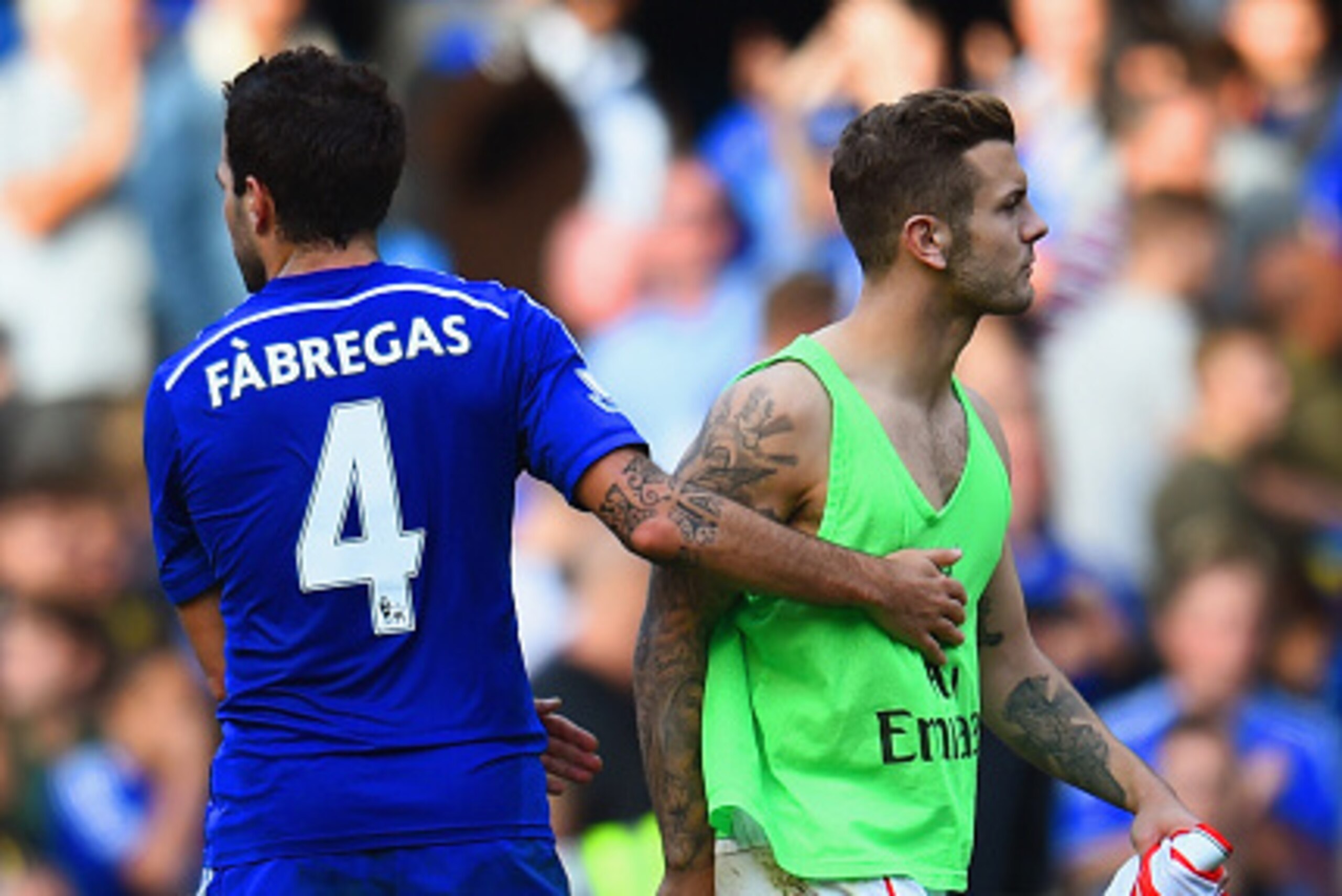 LONDON, ENGLAND - OCTOBER 05: Cesc Fabregas of Chelsea consoles Jack Wilshere of Arsenal after the Barclays Premier League match between Chelsea and Arsenal at Stamford Bridge on October 4, 2014 in London, England. (Photo by Shaun Botterill/Getty Images LONDON, ENGLAND - OCTOBER 05: Cesc Fabregas of Chelsea consoles Jack Wilshere of Arsenal after the Barclays Premier League match between Chelsea and Arsenal at Stamford Bridge on October 4, 2014 in London, England. (Photo by Shaun Botterill/Getty Images