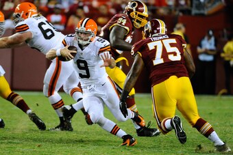 Aug 18, 2014; Landover, MD, USA; Cleveland Browns quarterback Connor Shaw (9) scrambles against the Washington Redskins during the second half at FedEx Field. Mandatory Credit: Brad Mills-USA TODAY Sports