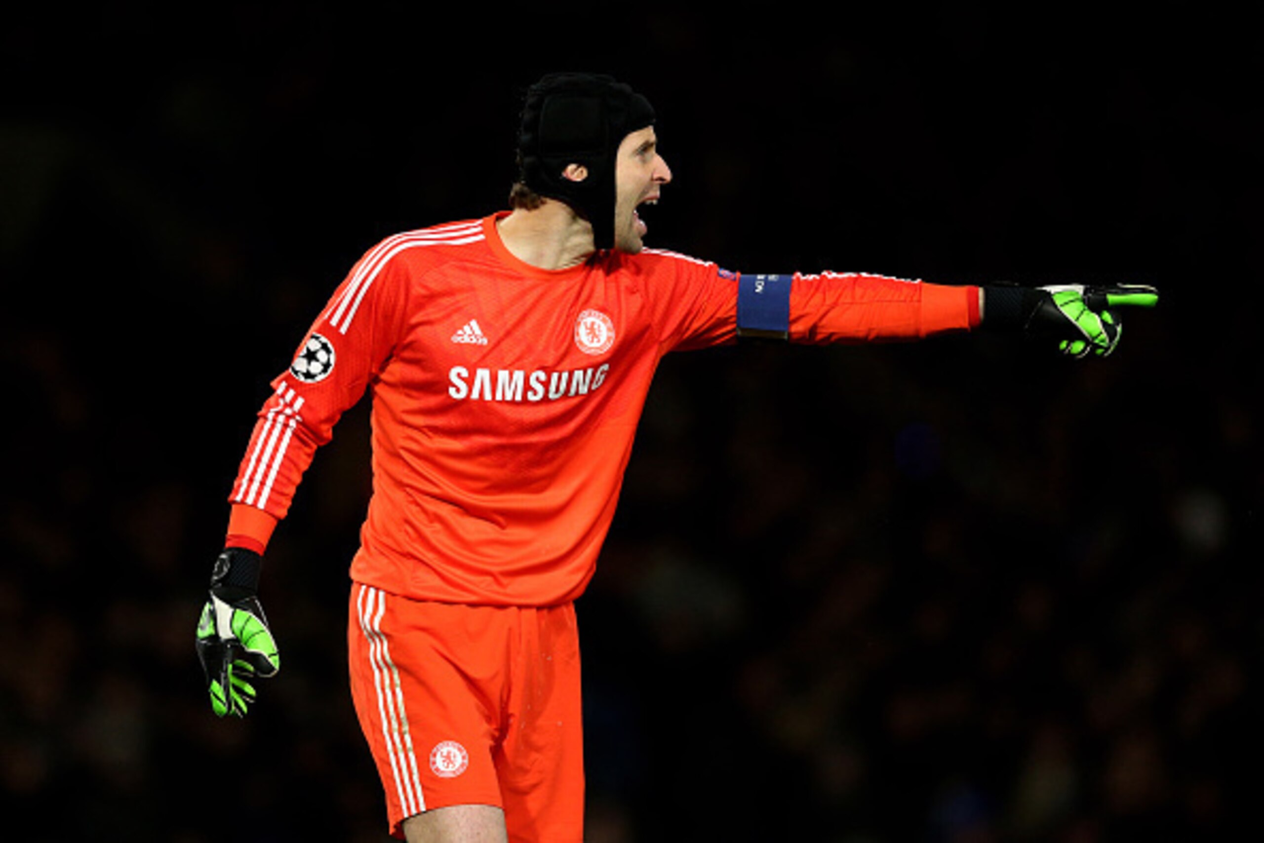 LONDON, ENGLAND - DECEMBER 10:  Petr Cech of Chelsea directs his defence during the UEFA Champions League group G match between Chelsea and Sporting Clube de Portugal at Stamford Bridge on December 10, 2014 in London, United Kingdom.  (Photo by Clive Maso