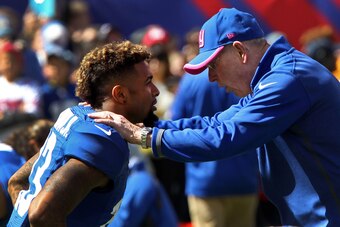 Oct 5, 2014; East Rutherford, NJ, USA; New York Giants head coach Tom Coughlin talks to New York Giants wide receiver Odell Beckham (13) before the game against the Atlanta Falcons  at MetLife Stadium. Mandatory Credit: Noah K. Murray-USA TODAY Sports