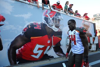 TAMPA, FL - OCTOBER 26: Outside linebacker Lavonte David #54 of the Tampa Bay Buccaneers walks off the field after their loss against the Minnesota Vikings at Raymond James Stadium on October 26, 2014 in Tampa, Florida. (Photo by Cliff McBride/Getty Image