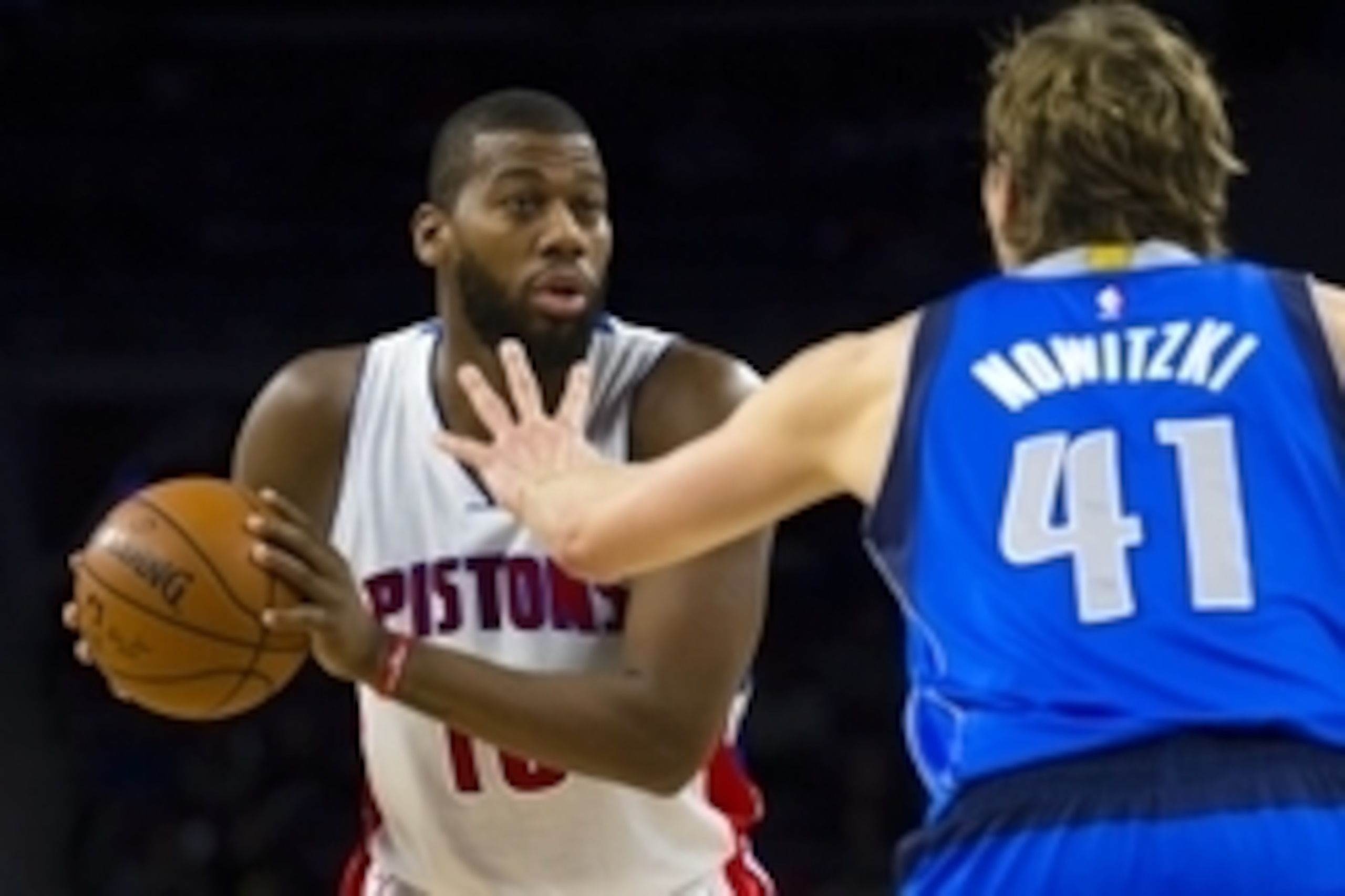 Dec 17, 2014; Auburn Hills, MI, USA; Detroit Pistons forward Greg Monroe (10) is defended by Dallas Mavericks forward Dirk Nowitzki (41) in the third quarter at The Palace of Auburn Hills. Dallas won 117-106. Mandatory Credit: Rick Osentoski-USA TODAY Spo