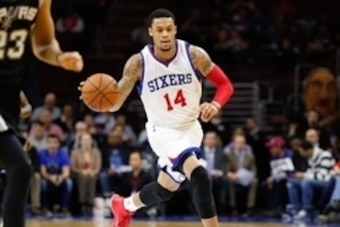 Dec 1, 2014; Philadelphia, PA, USA; Philadelphia 76ers guard K.J. McDaniels (14) in a game against the San Antonio Spurs during the second half at Wells Fargo Center. The Spurs defeated the 76ers 109-103. Mandatory Credit: Bill Streicher-USA TODAY Sports