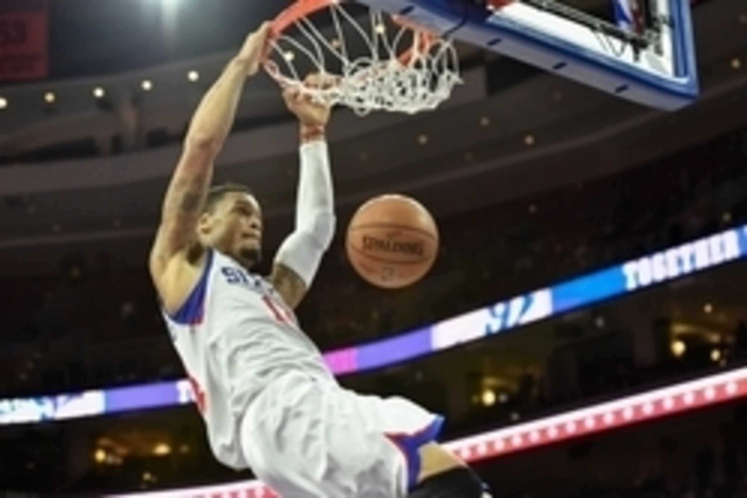 Nov 26, 2014; Philadelphia, PA, USA; Philadelphia 76ers guard K.J. McDaniels (14) dunks during the fourth quarter against the Brooklyn Nets at the Wells Fargo Center. The Nets won the game 99-91. Mandatory Credit: John Geliebter-USA TODAY Sports