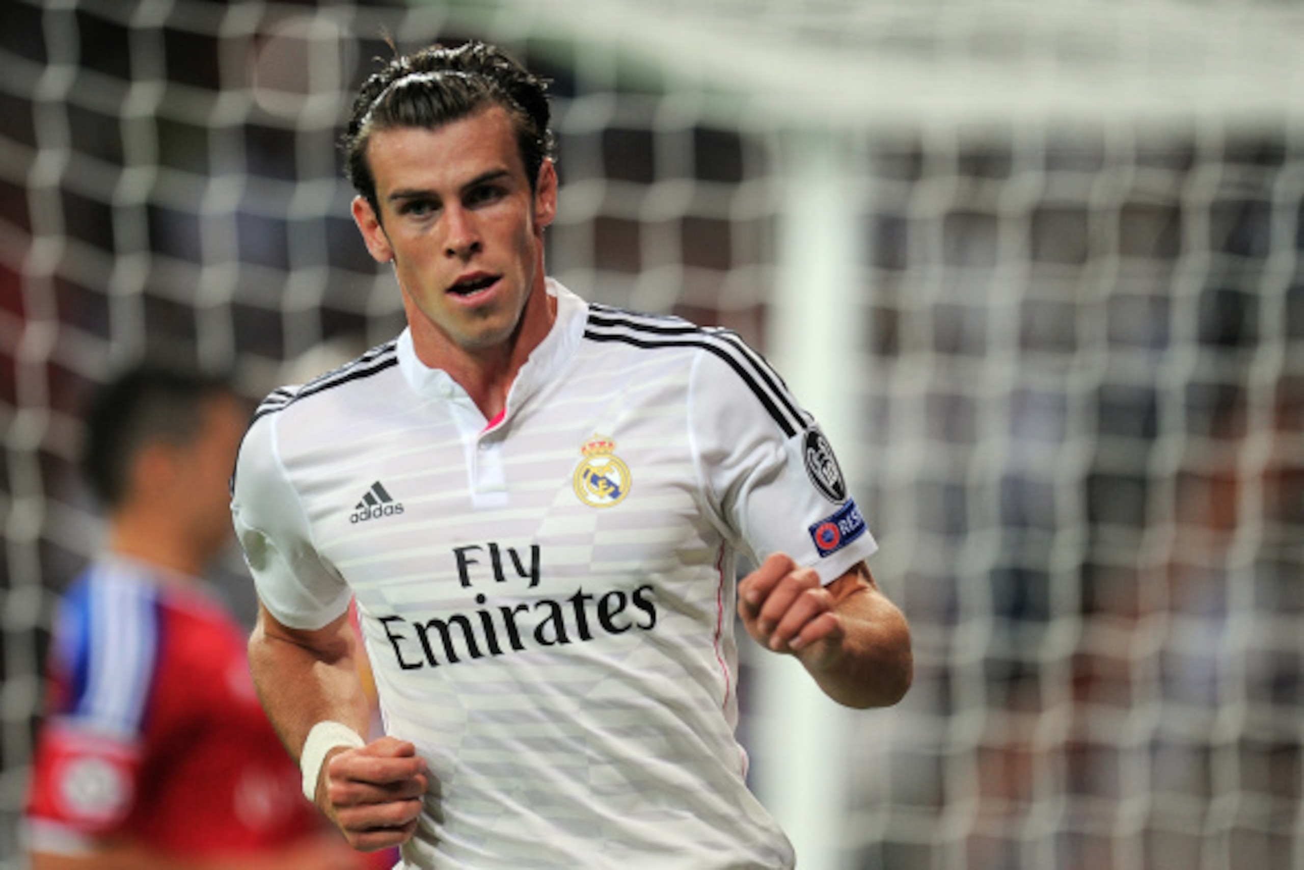 MADRID, SPAIN - SEPTEMBER 16:  Gareth Bale of Real Madrid celebrates after scoring Real's seconnd goal during the UEFA Champions League Group B match between Real Madrid CF and FC Basel 1893 on September 16, 2014 in Madrid, Spain.  (Photo by Denis Doyle/G