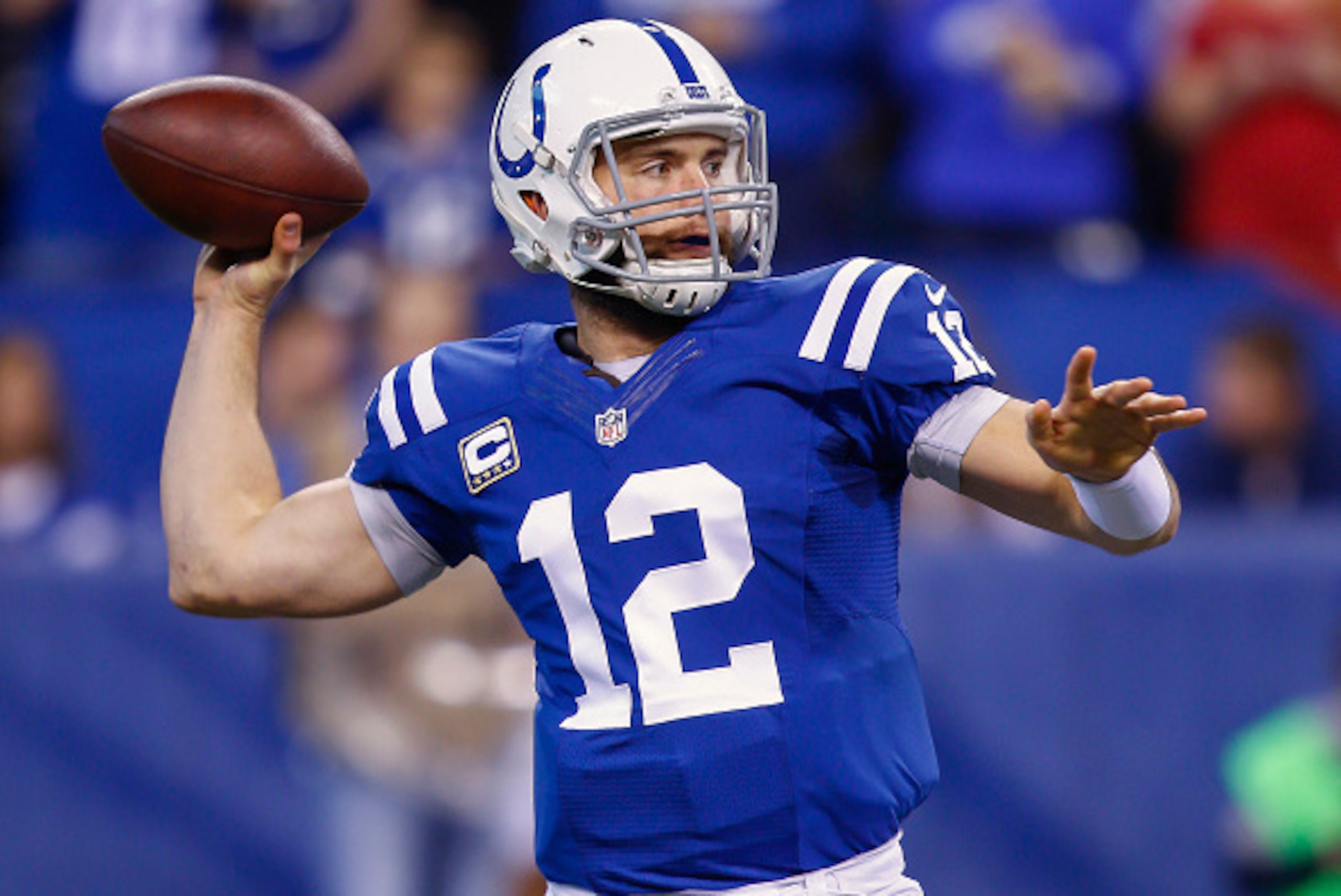 INDIANAPOLIS, IN - DECEMBER  14: Andrew Luck #12 of the Indianapolis Colts drops back to pass during the game against the Houston Texans at Lucas Oil Stadium on December 14, 2014 in Indianapolis, Indiana. (Photo by Michael Hickey/Getty Images)