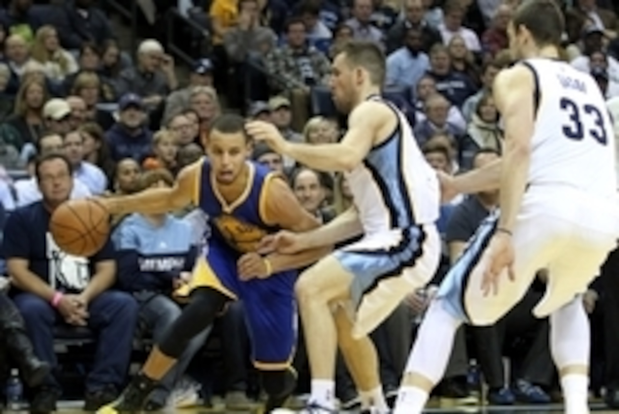 Dec 16, 2014; Memphis, TN, USA; Golden State Warriors guard Stephen Curry (30) drives against Memphis Grizzlies guard Beno Udrih (19) and center Marc Gasol (33) at FedExForum. Grizzlies defeated the Warriors 105-98. Mandatory Credit: Nelson Chenault-USA T