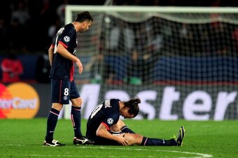 PARIS, FRANCE - APRIL 02:  Thiago Motta of PSG checks on teammate Zlatan Ibrahimovic after he goes down injured during the UEFA Champions League quarter final, first leg match between Paris Saint Germain and Chelsea at Parc des Princes on April 2, 2014 in
