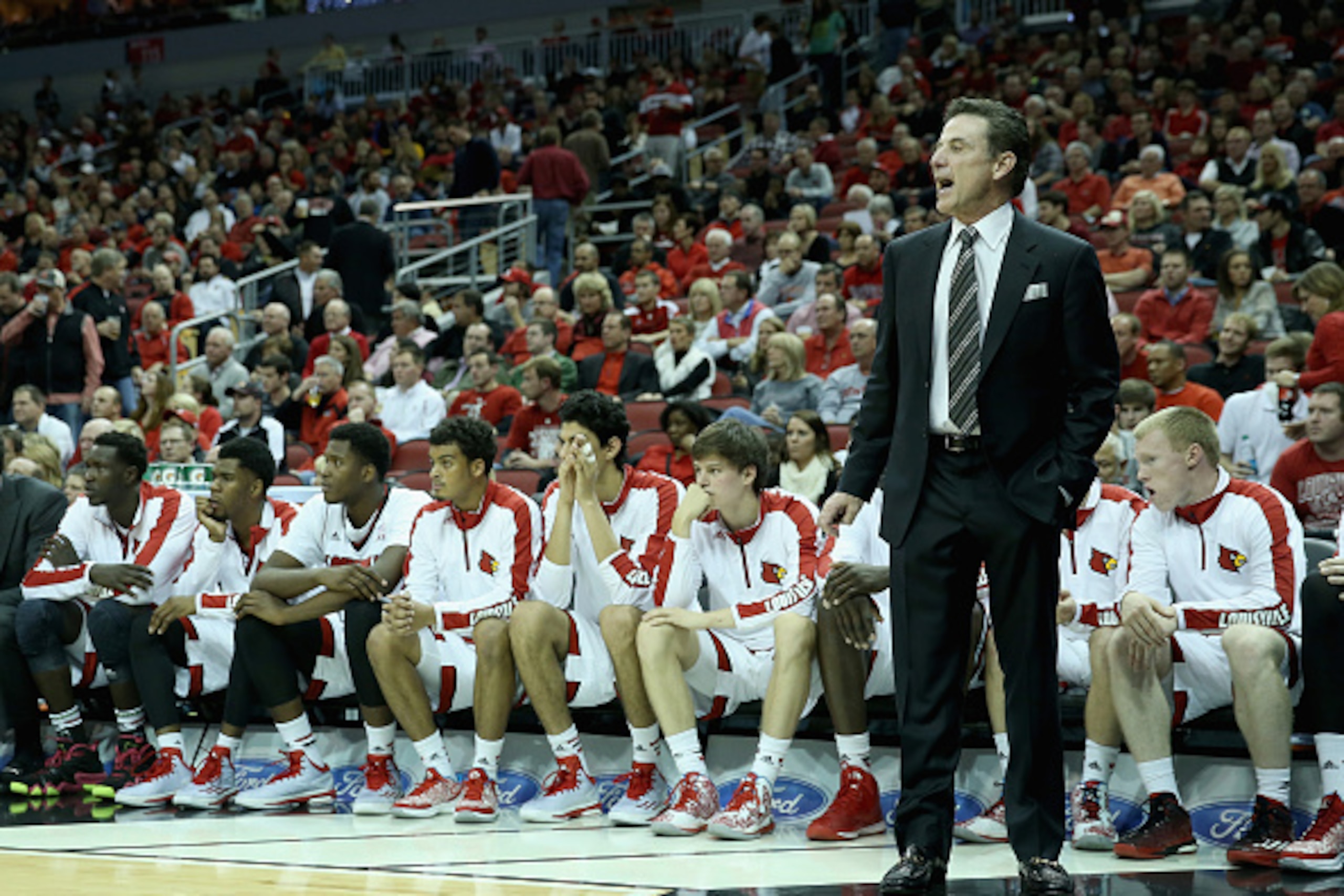 LOUISVILLE, KY - DECEMBER 02:  Rick Pitino the head coach of the Louisville Cardinals gives instructions to his team during the game against the Ohio State Buckeyes at KFC YUM! Center on December 2, 2014 in Louisville, Kentucky.  (Photo by Andy Lyons/Gett