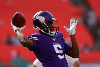 MIAMI GARDENS, FL - DECEMBER 21:  Quarterback Teddy Bridgewater #5 of the Minnesota Vikings throws during pregame warmups before meeting the Miami Dolphins in a game at Sun Life Stadium on December 21, 2014 in Miami Gardens, Florida.  (Photo by Mike Ehrma