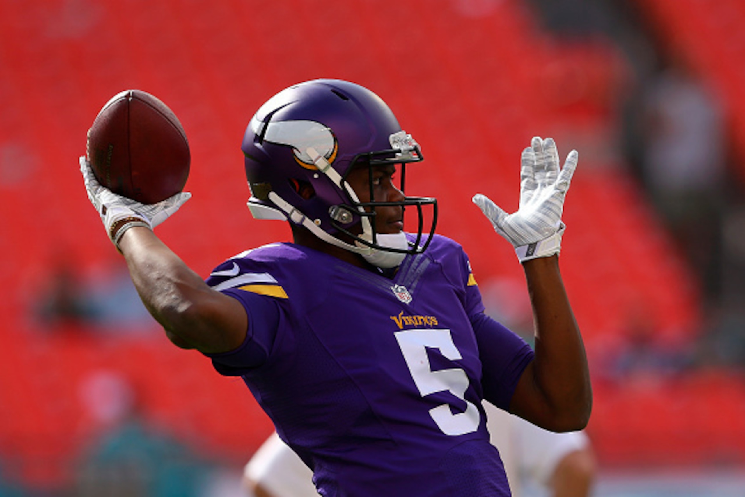 MIAMI GARDENS, FL - DECEMBER 21:  Quarterback Teddy Bridgewater #5 of the Minnesota Vikings throws during pregame warmups before meeting the Miami Dolphins in a game at Sun Life Stadium on December 21, 2014 in Miami Gardens, Florida.  (Photo by Mike Ehrma