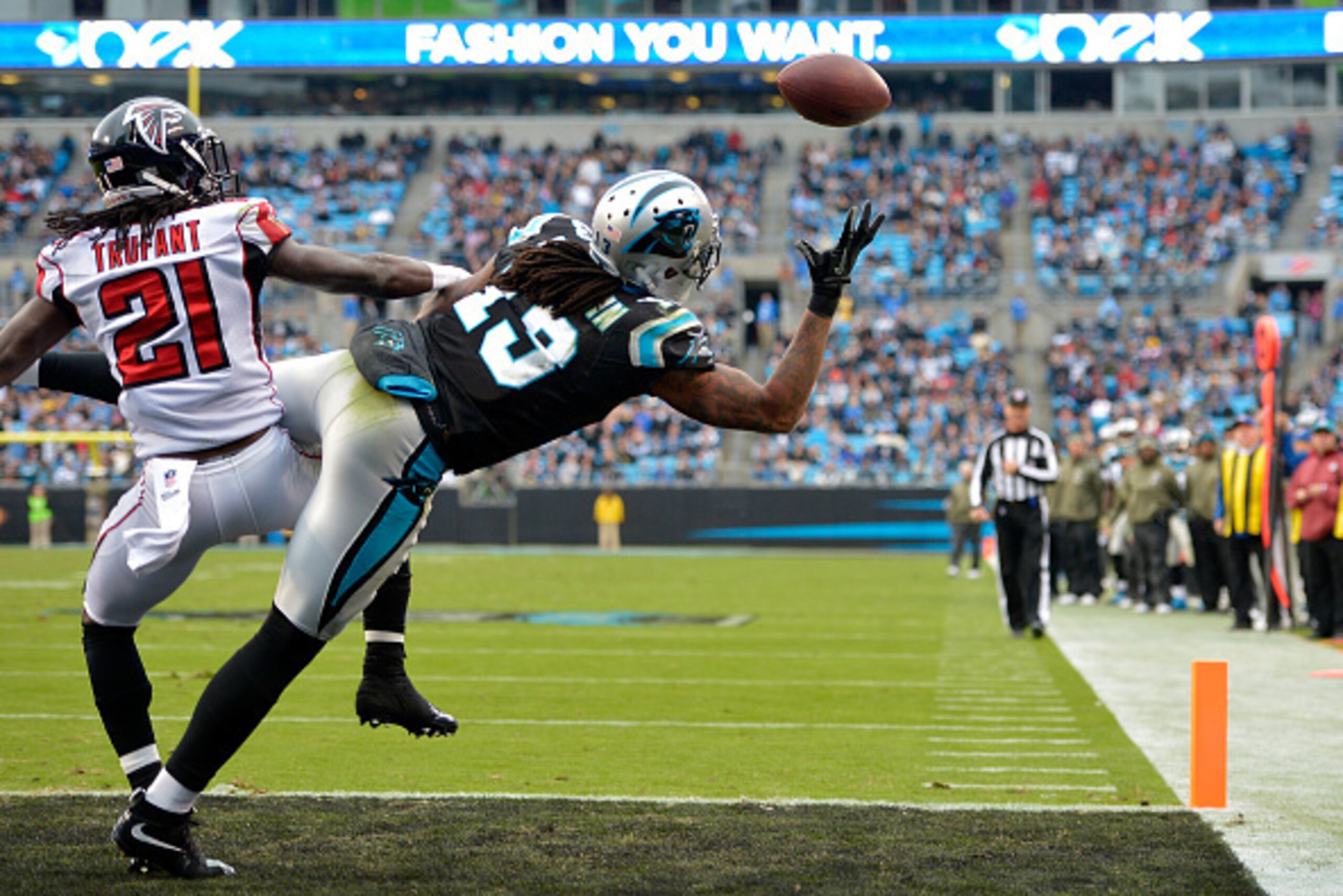 CHARLOTTE, NC - NOVEMBER 16:  Kelvin Benjamin #13 of the Carolina Panthers makes a 4th quarter touchdown reception against Desmond Trufant #21 of the Atlanta Falcons during their game at Bank of America Stadium on November 16, 2014 in Charlotte, North Car