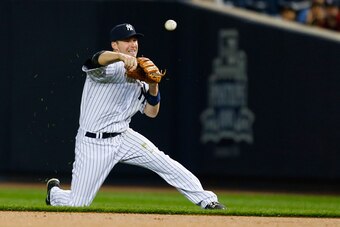 NEW YORK, NY - SEPTEMBER 22:  Stephen Drew #33 of the New York Yankees throws to first base for an out after making a diving stop of the ball against the Baltimore Orioles at Yankee Stadium on September 22, 2014 in the Bronx borough of New York City.  (Ph