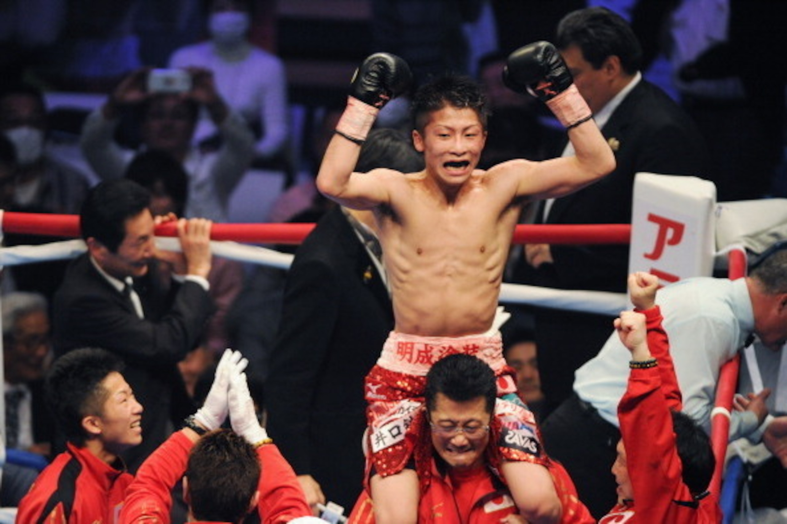 TOKYO, JAPAN - APRIL 06:  New champion,Naoya Inoue celebrates the victory after the WBC light flyweight title bout between Adrian Hernandez of Mexico v Naoya Inoue of Japan at Ota City General Gymnasium on April 6, 2014 in Tokyo, Japan.  (Photo by Masashi