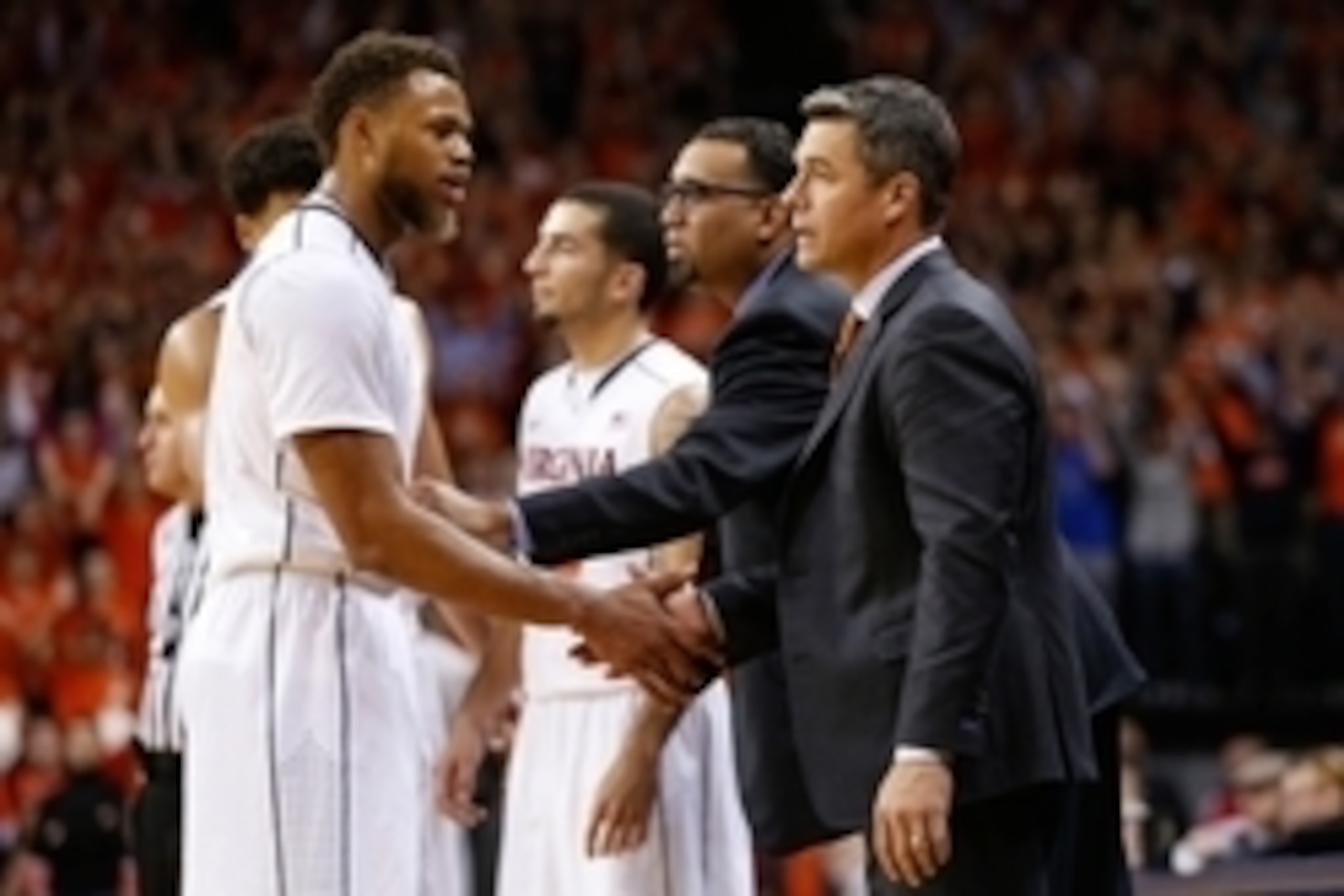Nov 21, 2014; Charlottesville, VA, USA; Virginia Cavaliers guard Justin Anderson (1) talks to Cavaliers head coach Tony Bennett (R) against the George Washington Colonials at John Paul Jones Arena. Mandatory Credit: Amber Searls-USA TODAY Sports