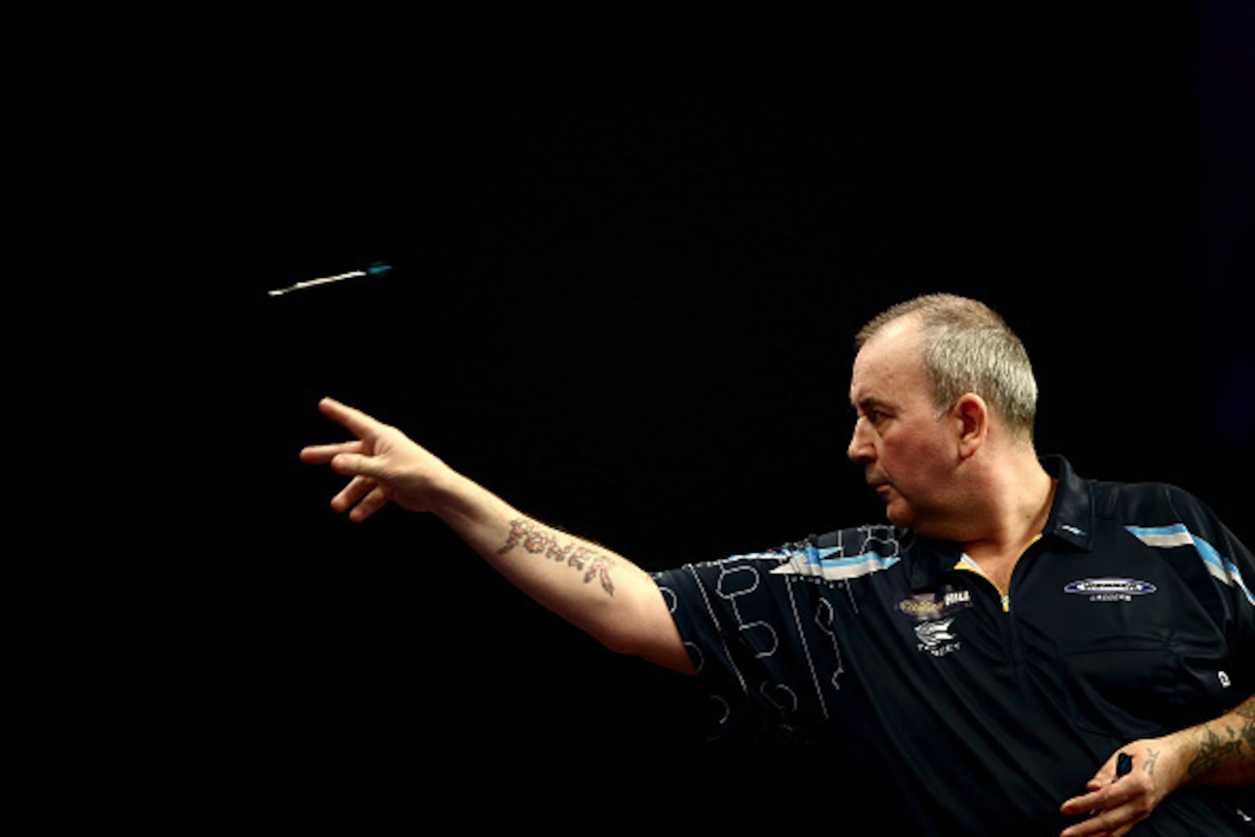LONDON, ENGLAND - DECEMBER 19:  Phil Taylor of England in action during his first round match against Jyhan Artut of Germany on Day Two of the William Hill PDC World Darts Championships at Alexandra Palace on December 19, 2014 in London, England.  (Photo 