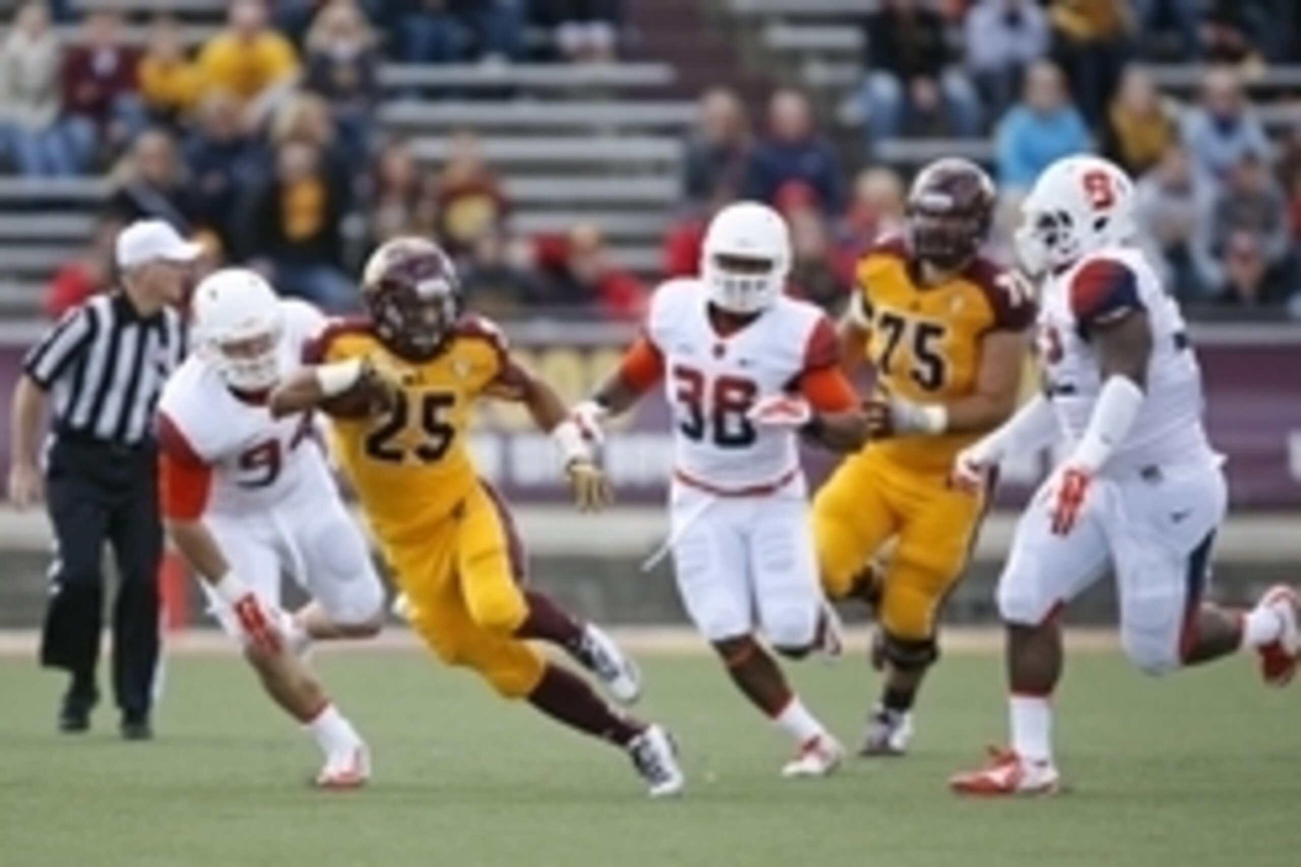 Sep 13, 2014; Mount Pleasant, MI, USA; Central Michigan Chippewas running back Devon Spalding (25) runs the ball during the first quarter against the Syracuse Orange at Kelly/Shorts Stadium. Mandatory Credit: Raj Mehta-USA TODAY Sports