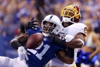 Nov 30, 2014; Indianapolis, IN, USA; Indianapolis Colts cornerback Vontae Davis (21) breaks up a pass in the end zone intended for Washington Redskins wide receiver Pierre Garcon (88) at Lucas Oil Stadium. Mandatory Credit: Brian Spurlock-USA TODAY Sports
