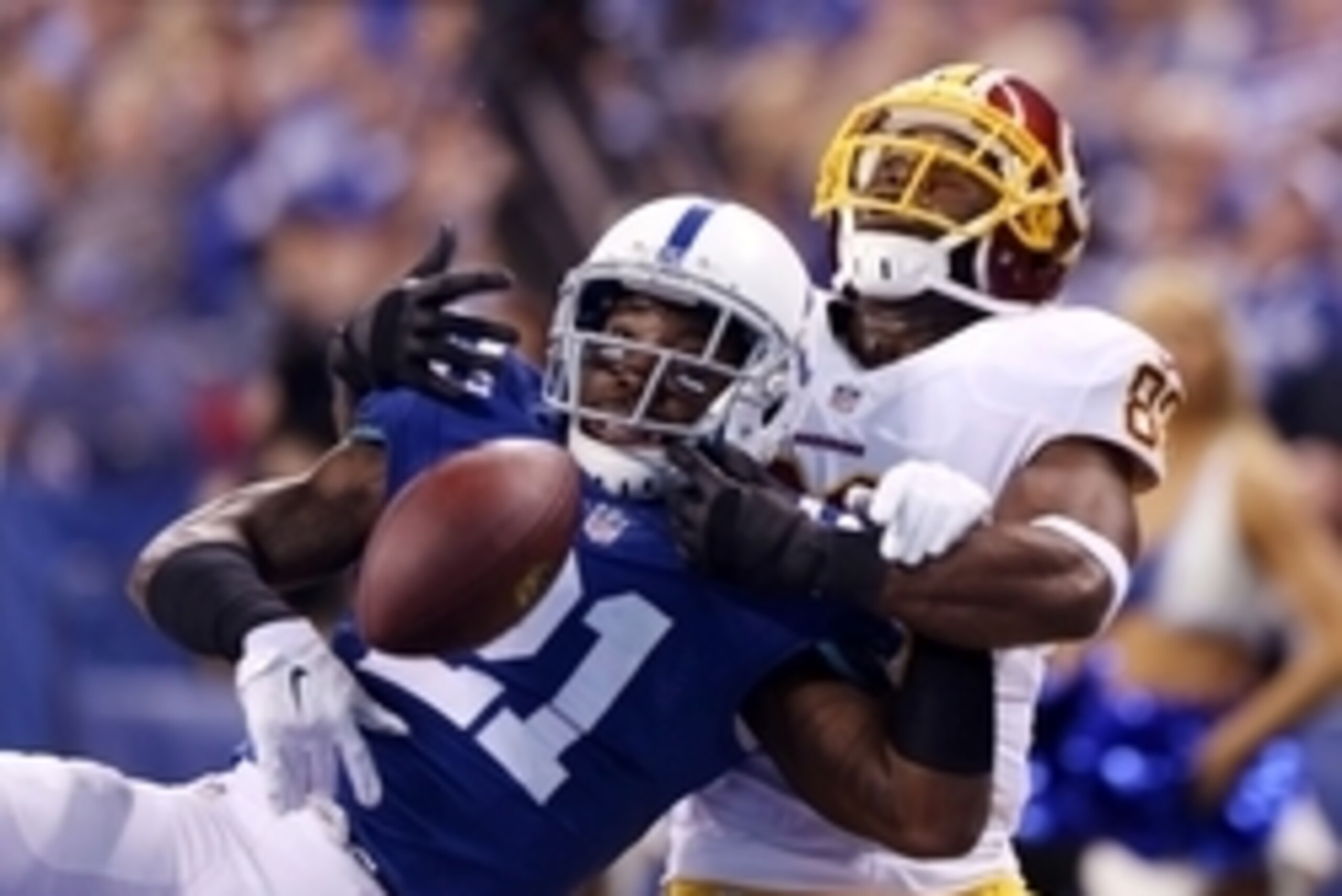Nov 30, 2014; Indianapolis, IN, USA; Indianapolis Colts cornerback Vontae Davis (21) breaks up a pass in the end zone intended for Washington Redskins wide receiver Pierre Garcon (88) at Lucas Oil Stadium. Mandatory Credit: Brian Spurlock-USA TODAY Sports