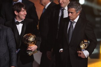 ZURICH, SWITZERLAND - JANUARY 10:  Lionel Messi (l) of Argentina and Barcelona FC winner of the men's player of the year alongside Jose Mourinho (r) of Portugal and Real Madrid FC winner of coach of the yea award during the FIFA Ballon d'or Gala at the Zu