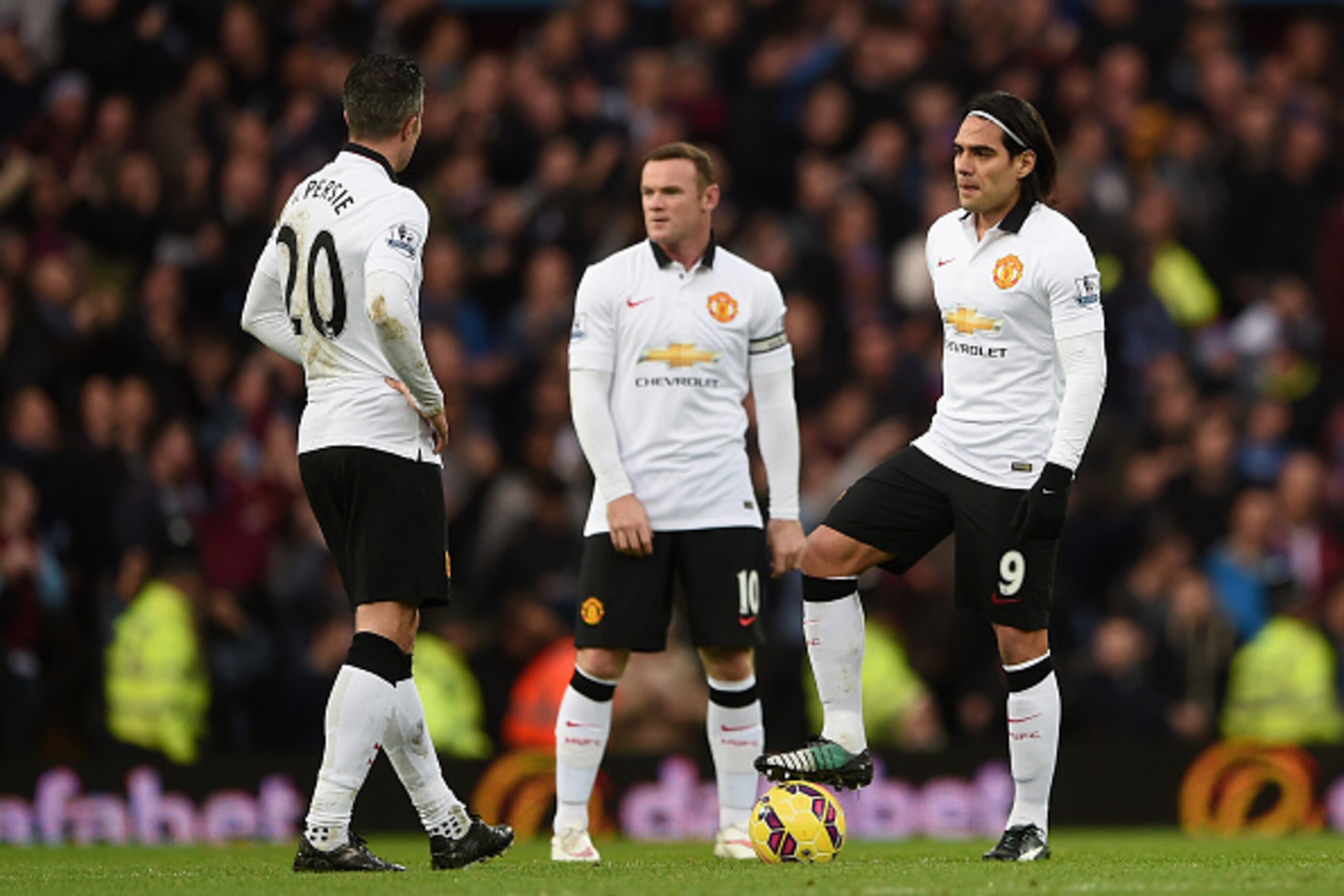 BIRMINGHAM, ENGLAND - DECEMBER 20:  A dejected Robin van Persie, Wayne Rooney and Radamel Falcao García of Manchester United prepare to restart after conceding the first goal during the Barclays Premier League match between Aston Villa and Manchester Unit