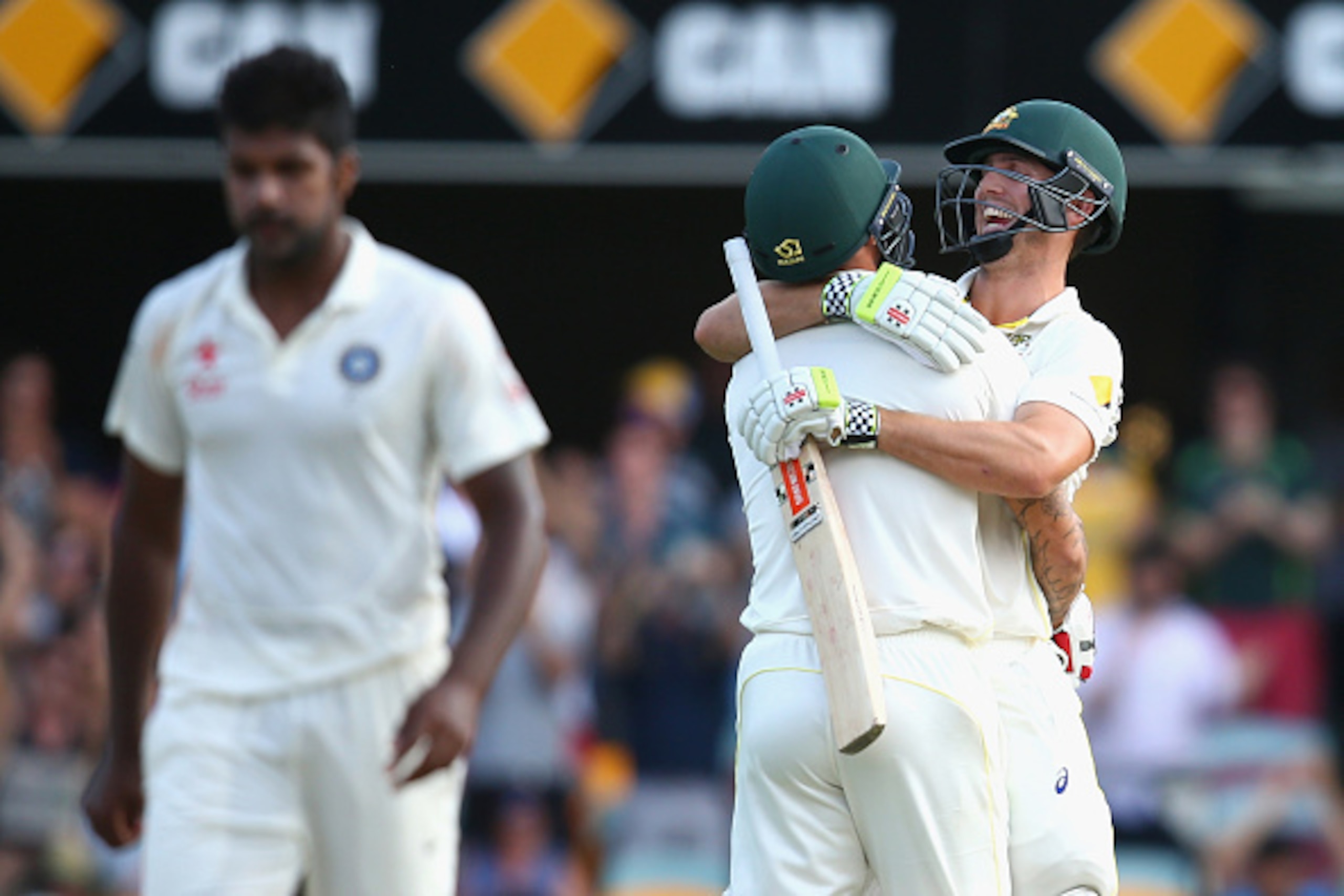 BRISBANE, AUSTRALIA - DECEMBER 20:  Mitch Marsh of Australia and Mitchell Johnson of Australia embrace as Marsh hits the winning runs to win the test during day four of the 2nd Test match between Australia and India at The Gabba on December 20, 2014 in Br