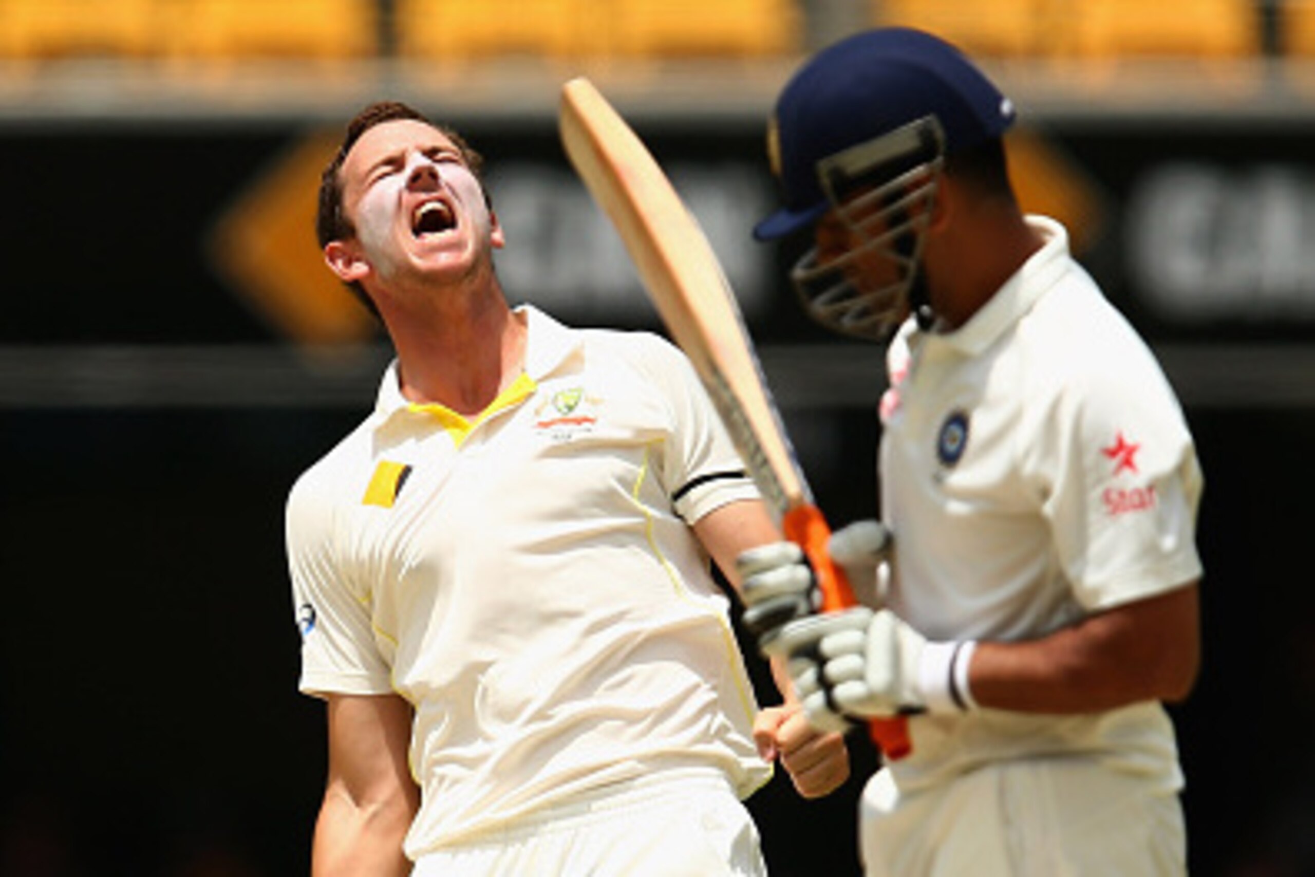 BRISBANE, AUSTRALIA - DECEMBER 20:  Josh Hazlewood of Australia celebrates dismissing MS Dhoni of India for lbw during day four of the 2nd Test match between Australia and India at The Gabba on December 20, 2014 in Brisbane, Australia.  (Photo by Cameron 