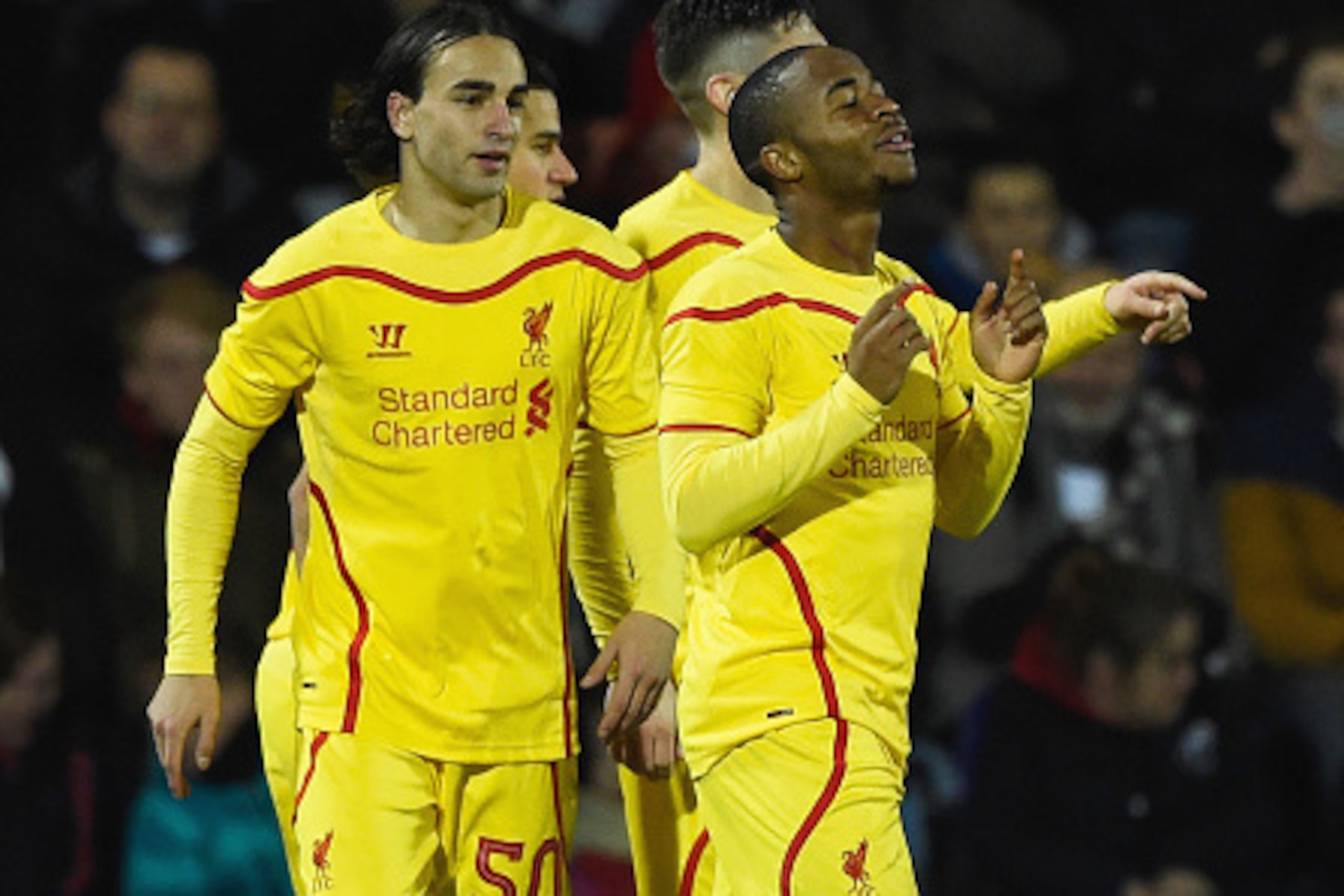 BOURNEMOUTH, ENGLAND - DECEMBER 17: Raheem Sterling of Liverpool celebrates scoring his team's third goal with Lazar Markovic (L) during the Capital One Cup Quarter-Final match between Bournemouth and Liverpool at Goldsands Stadium on December 17, 2014 i BOURNEMOUTH, ENGLAND - DECEMBER 17: Raheem Sterling of Liverpool celebrates scoring his team's third goal with Lazar Markovic (L) during the Capital One Cup Quarter-Final match between Bournemouth and Liverpool at Goldsands Stadium on December 17, 2014 i