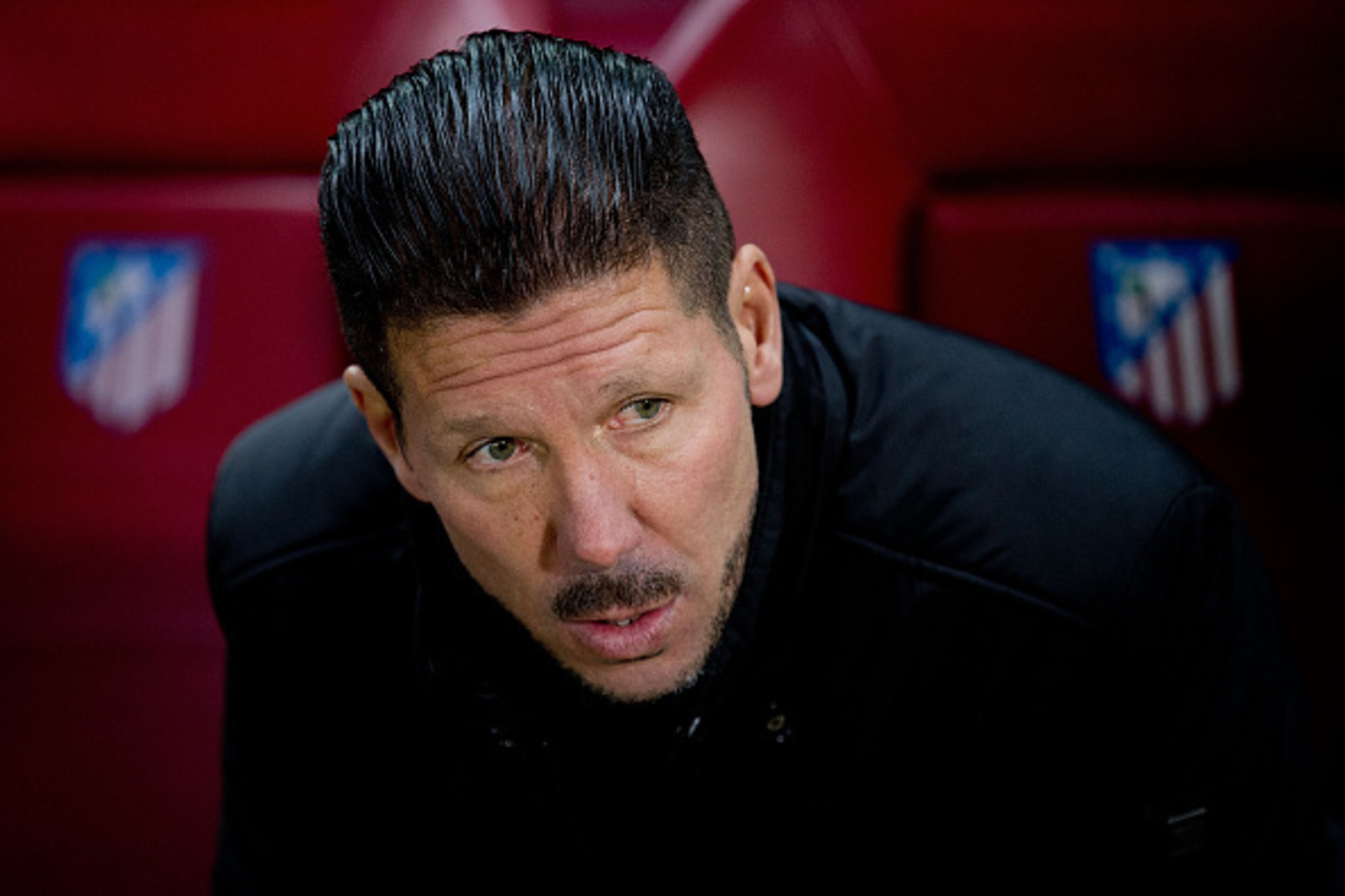 MADRID, SPAIN - DECEMBER 14:  Head coach Diego Pablo Simeone of Atletico de Madrid sits on the bench prior to start the La Liga match between Club Atletico de Madrid and Villarreal CF at Vicente Calderon Stadium on December 14, 2014 in Madrid, Spain.  (Ph