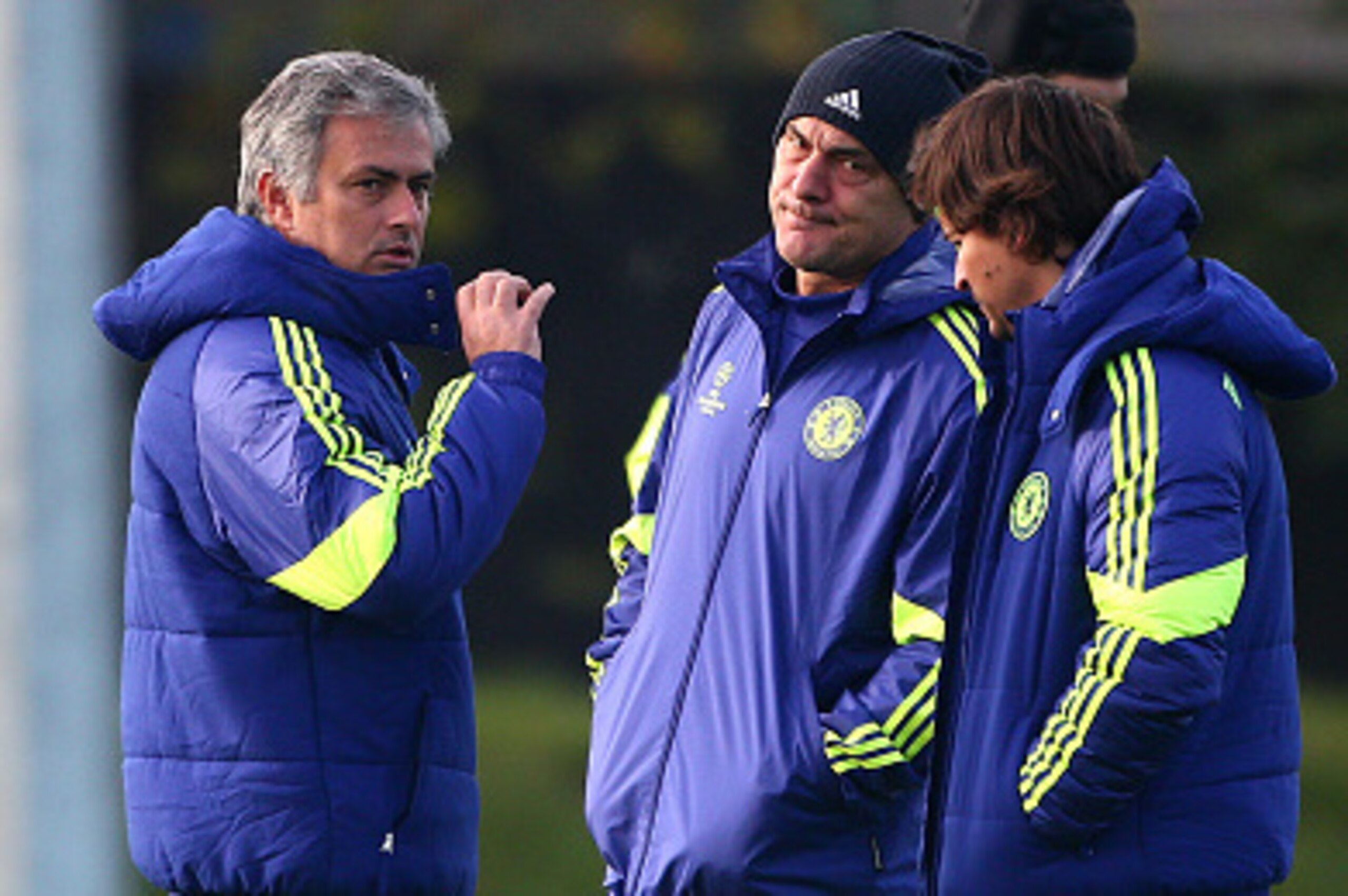 COBHAM, ENGLAND - NOVEMBER 24: Chelsea manager Jose Mourinho chat to his coaching staff during the warm up during a Chelsea Training Session ahead of their Champions League fixture against FC Schalke on November 24, 2014 in Cobham, England. (Photo by Char