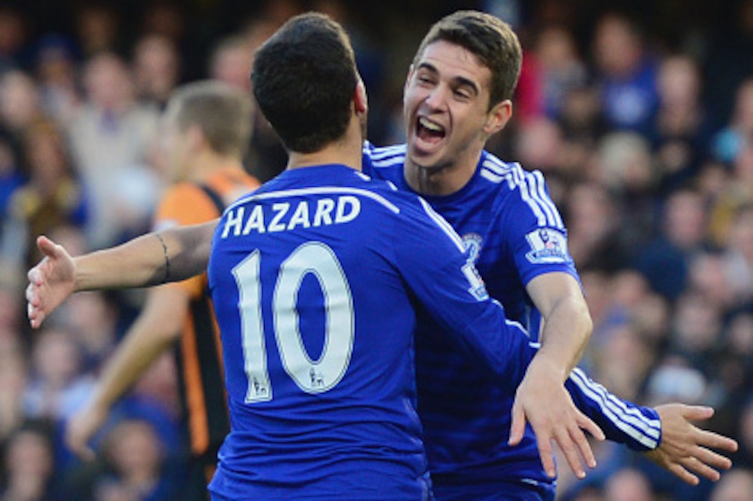 LONDON, ENGLAND - DECEMBER 13:  Eden Hazard of Chelsea (10) celebrates with Oscar as he scores their first goal  during the Barclays Premier League match between Chelsea and Hull City at Stamford Bridge on December 13, 2014 in London, England.  (Photo by 